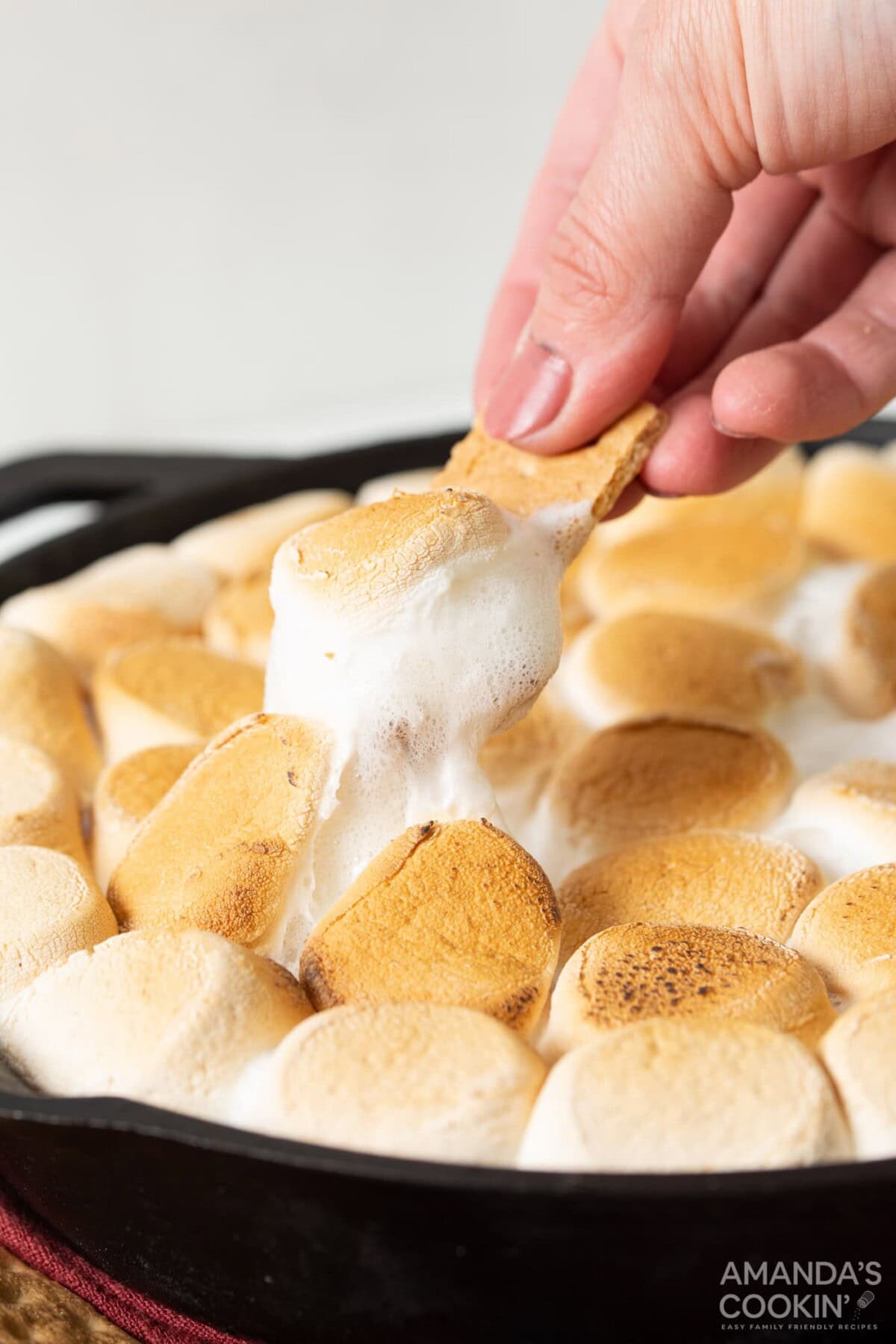 Scoop of S'mores Dip on a graham cracker