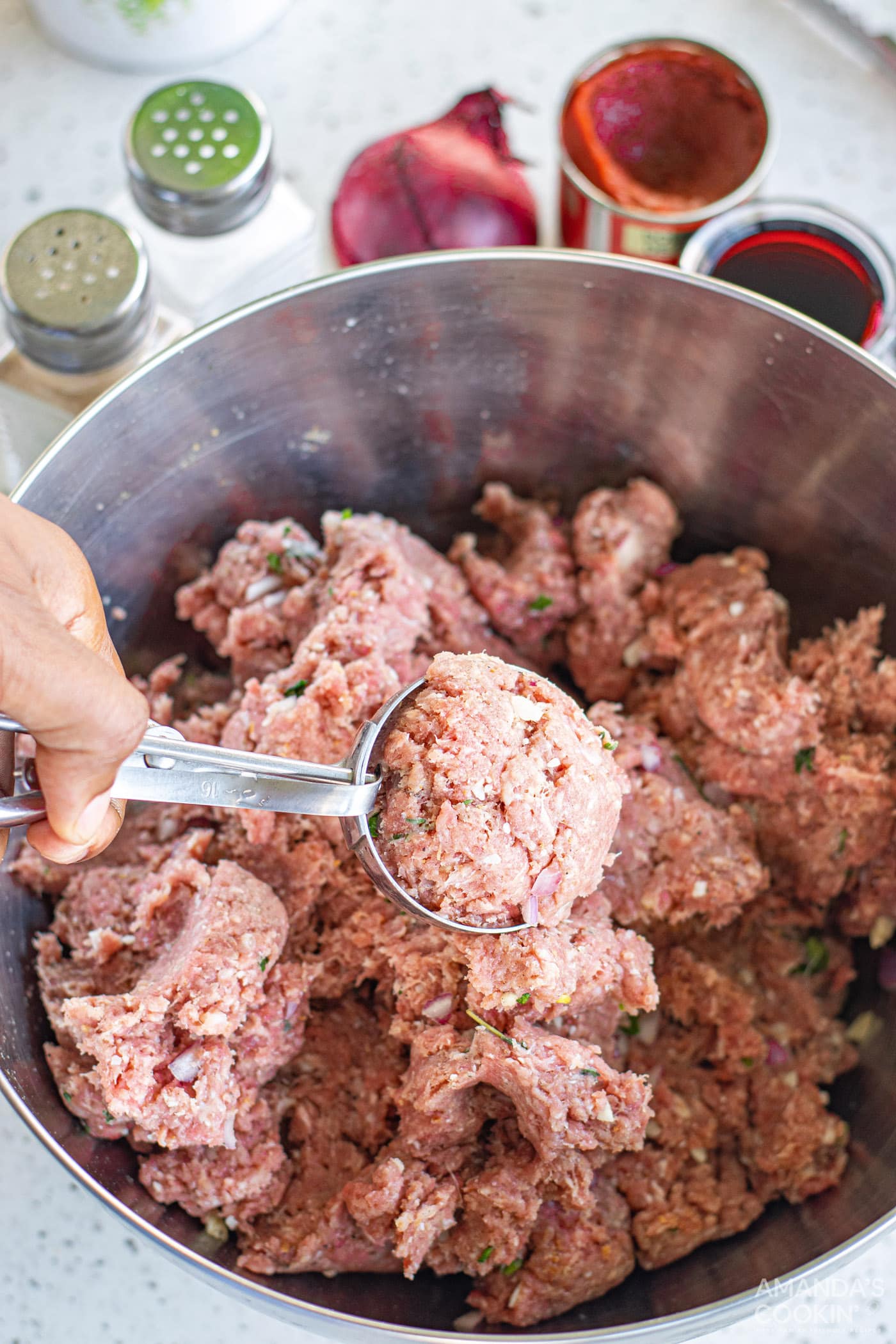 using a cookie scoop to create meatballs