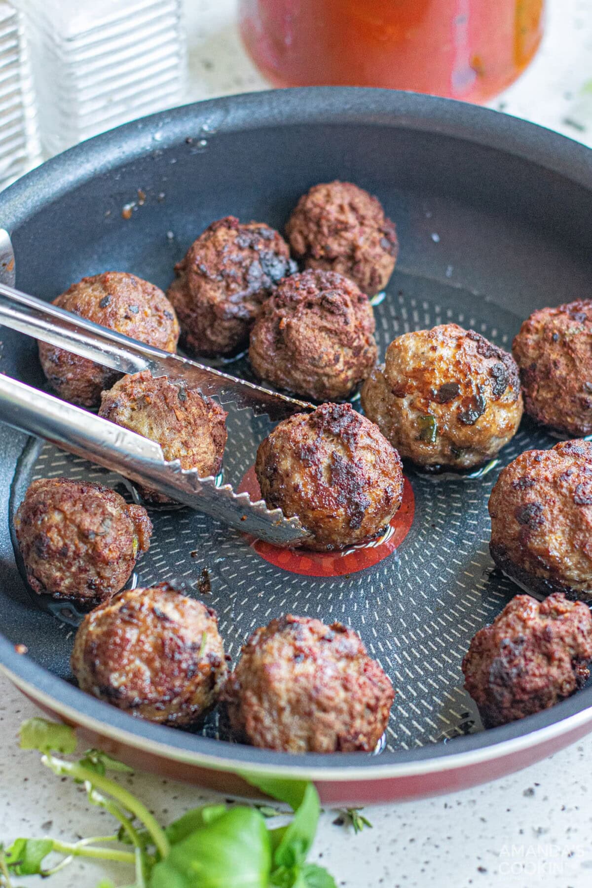 browning meatballs on a skillet