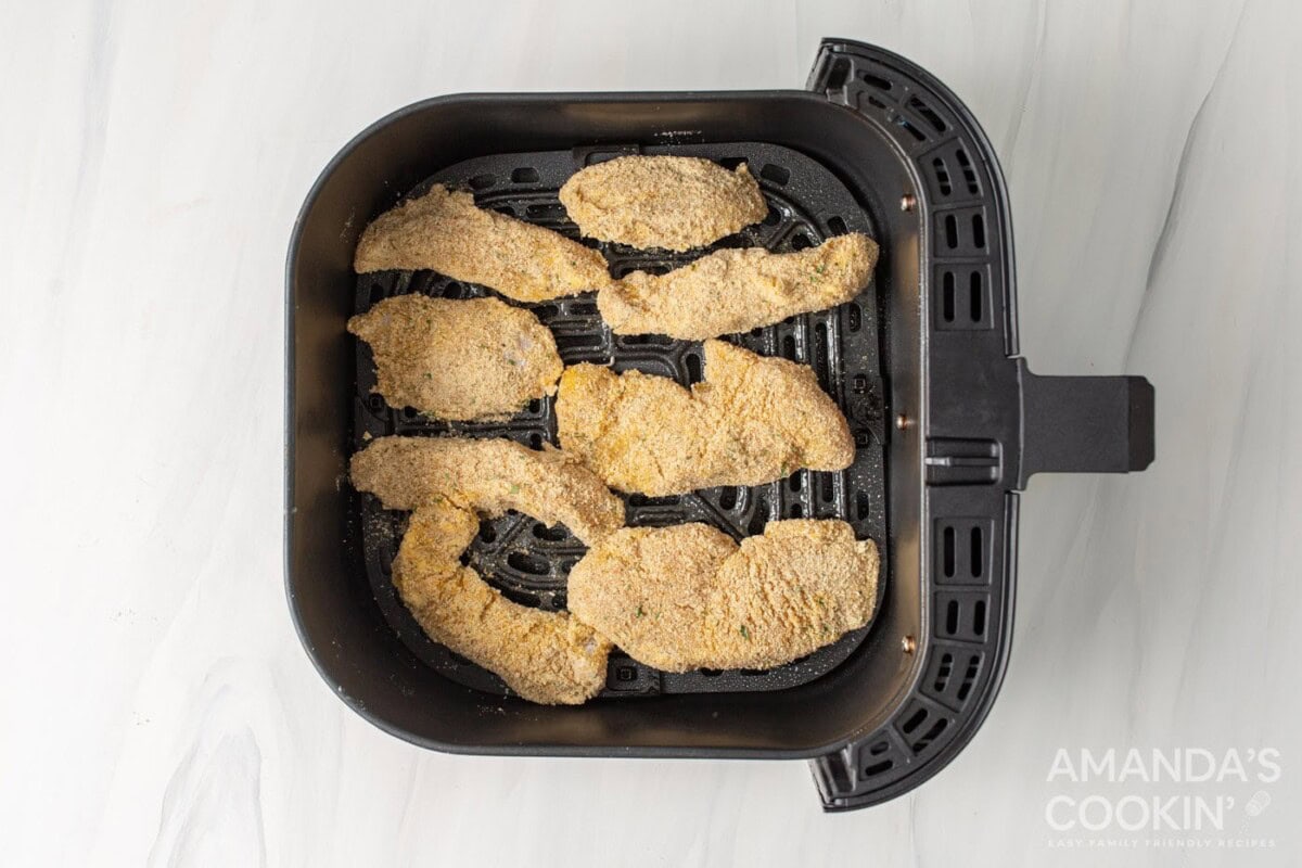 breaded chicken tenders in air fryer basket