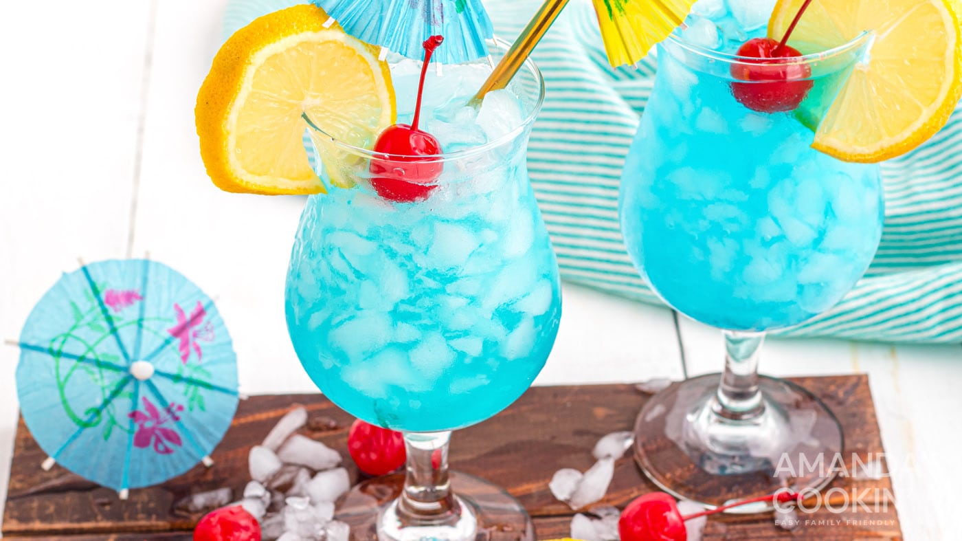 This blue lagoon cocktail is swimming with vodka, blue Curacao, and lemonade creating a bright and b
