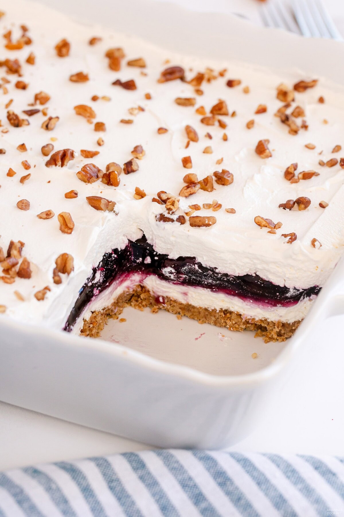 pan of blueberry lush with a slice removed