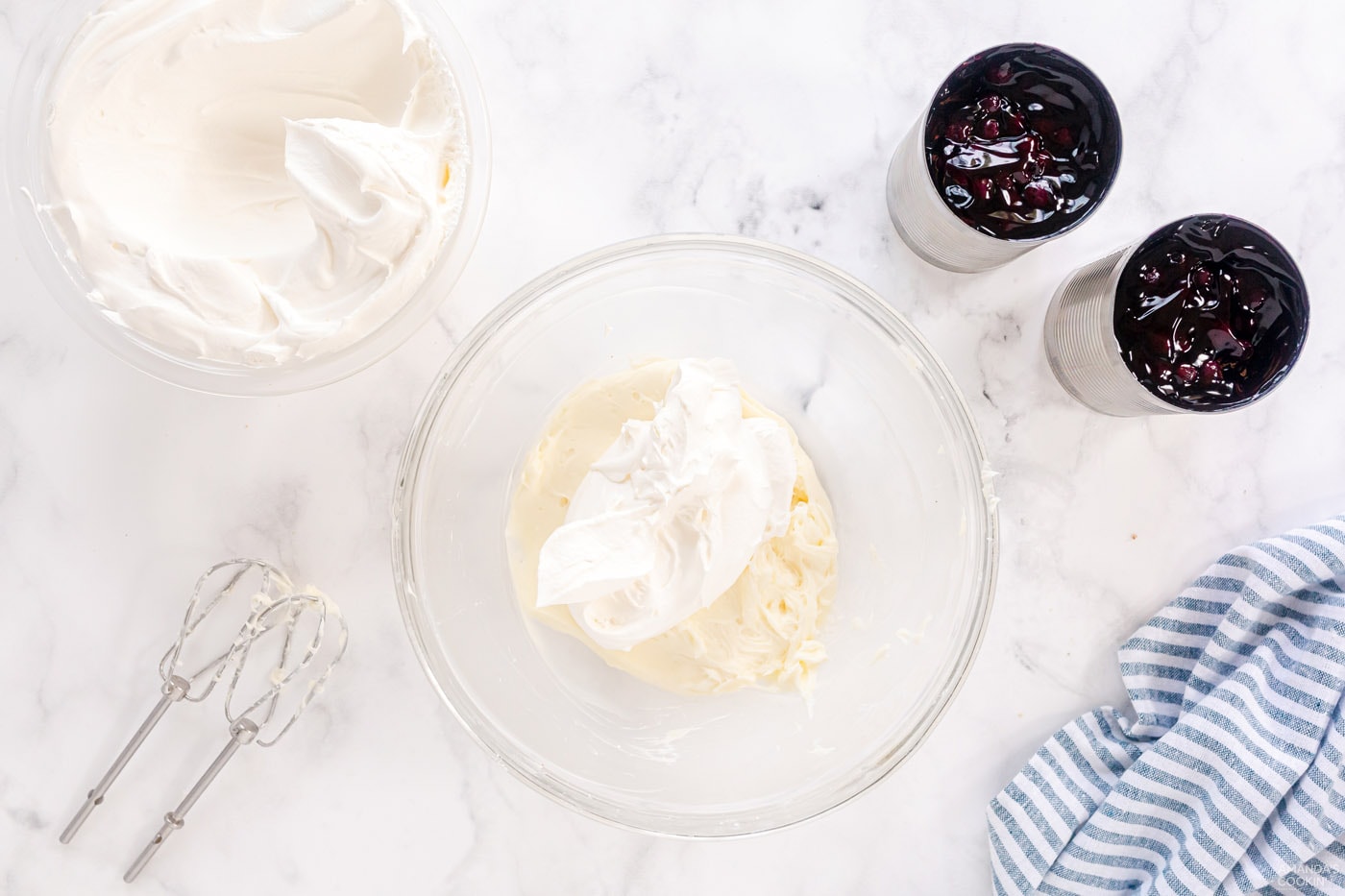 adding cool whip to cream cheese mixture