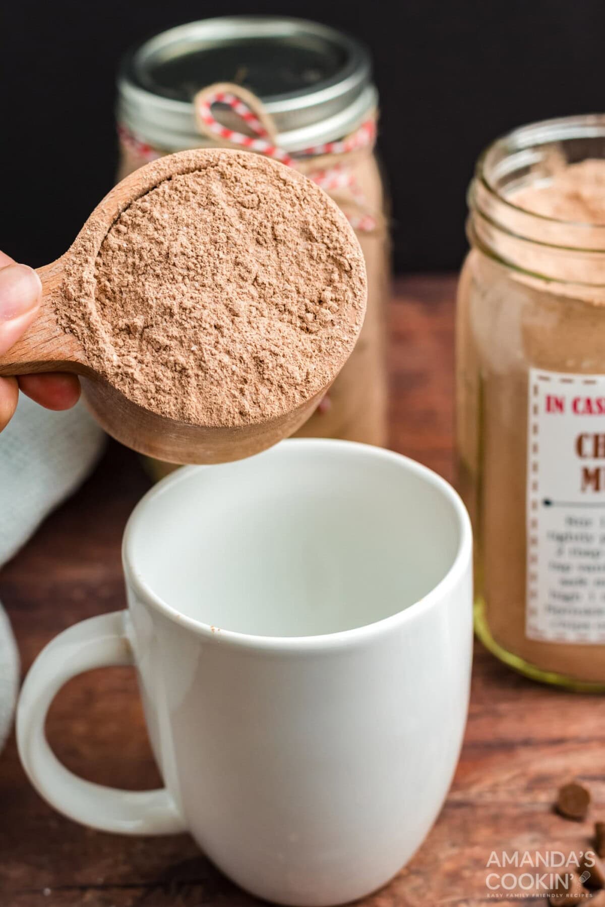 adding cake mix to a mug