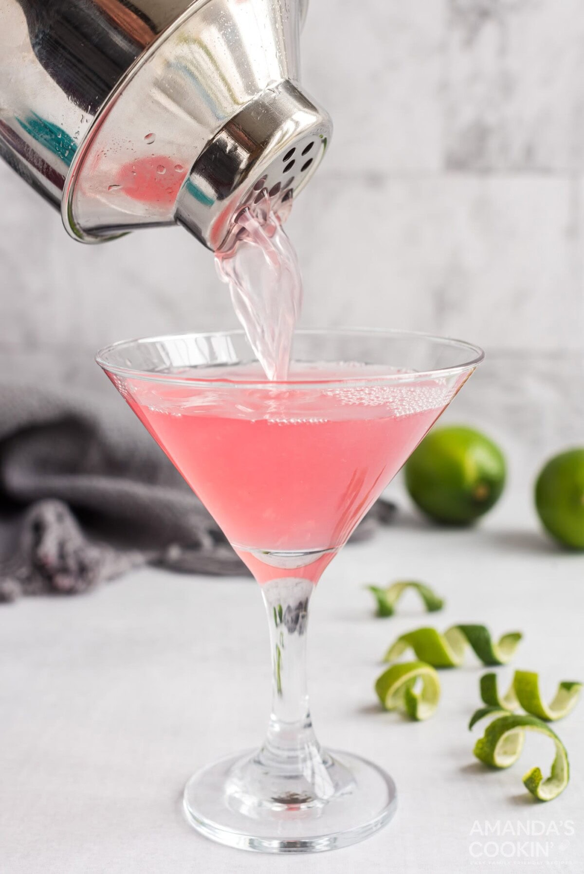 straining cosmo into glass
