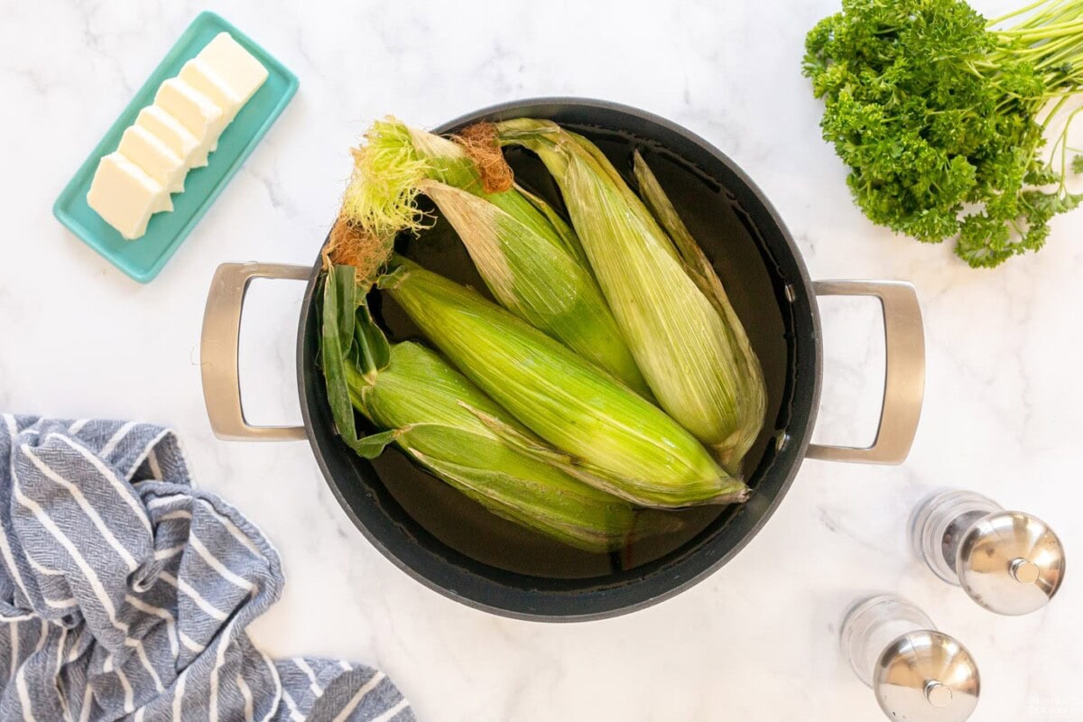 corn on the cob in a pot of water