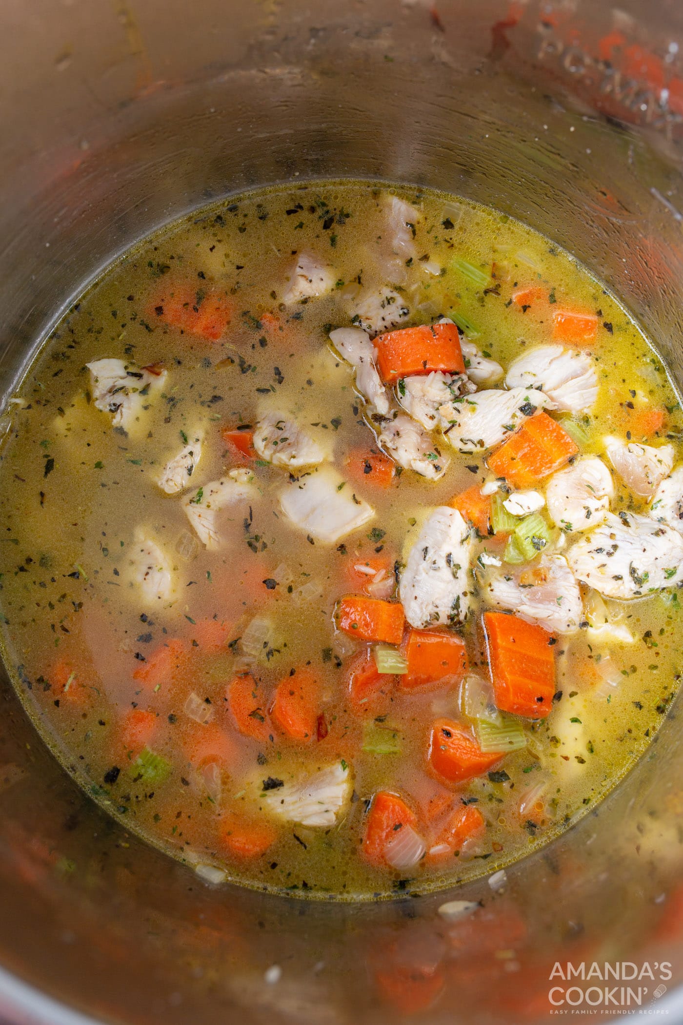 chicken stock with rice, chicken, and veggies in instant pot
