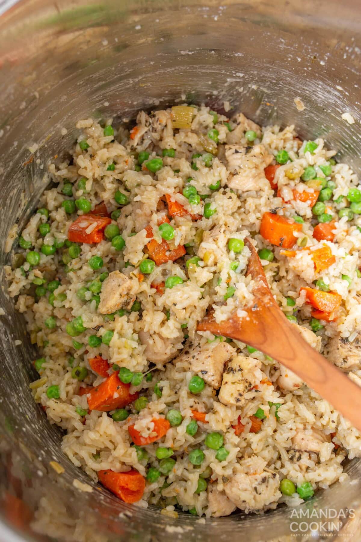 stirring chicken and rice in the instant pot