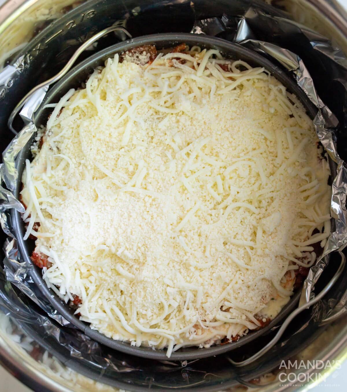 springform pan wrapped in aluminum foil in the instant pot