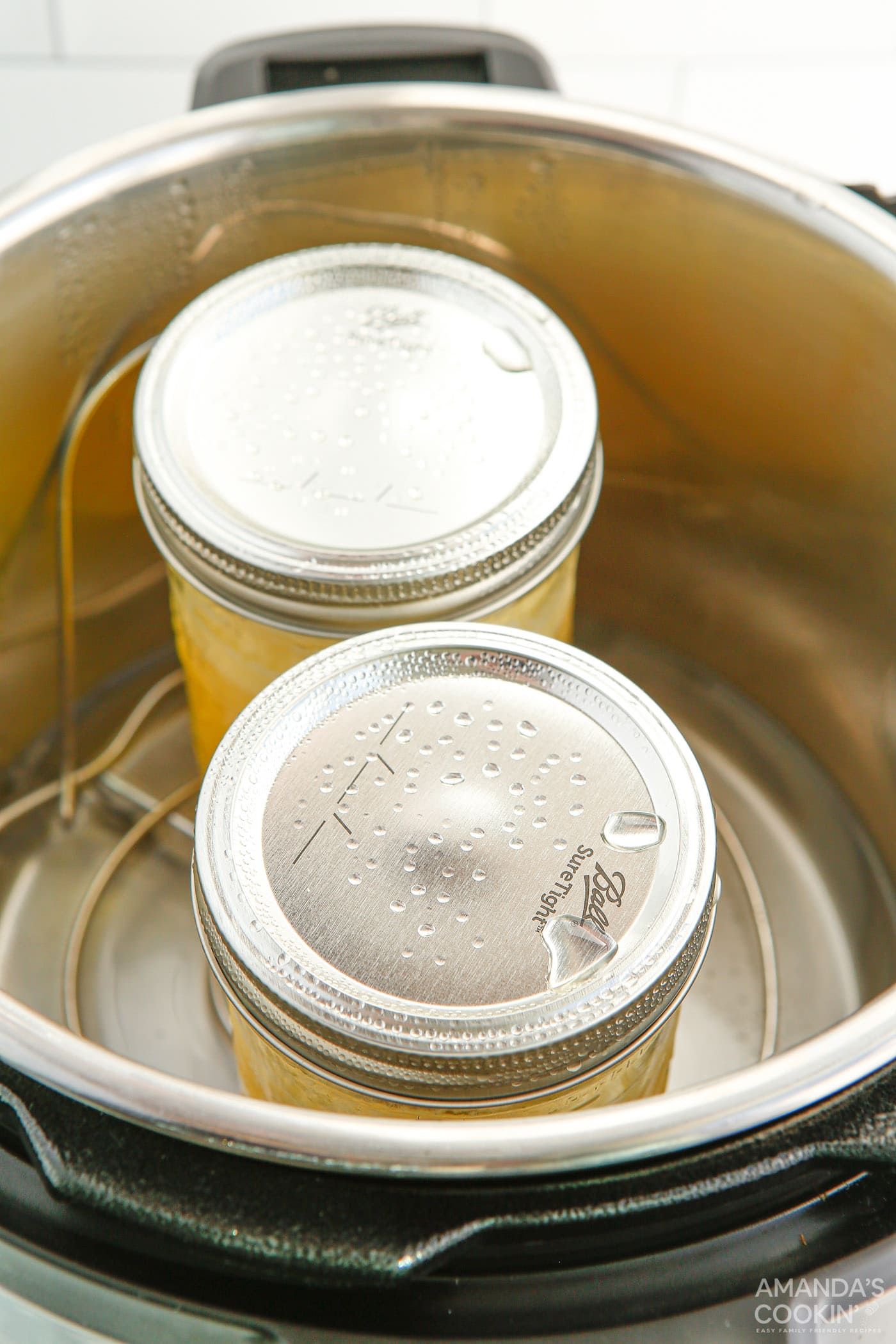 mason jars with lemon curd in an instant pot trivet