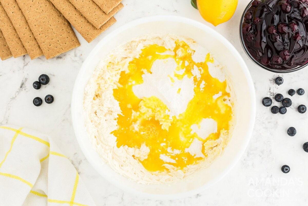 pudding mix, lemon juice, vanilla extract, and milk in a bowl