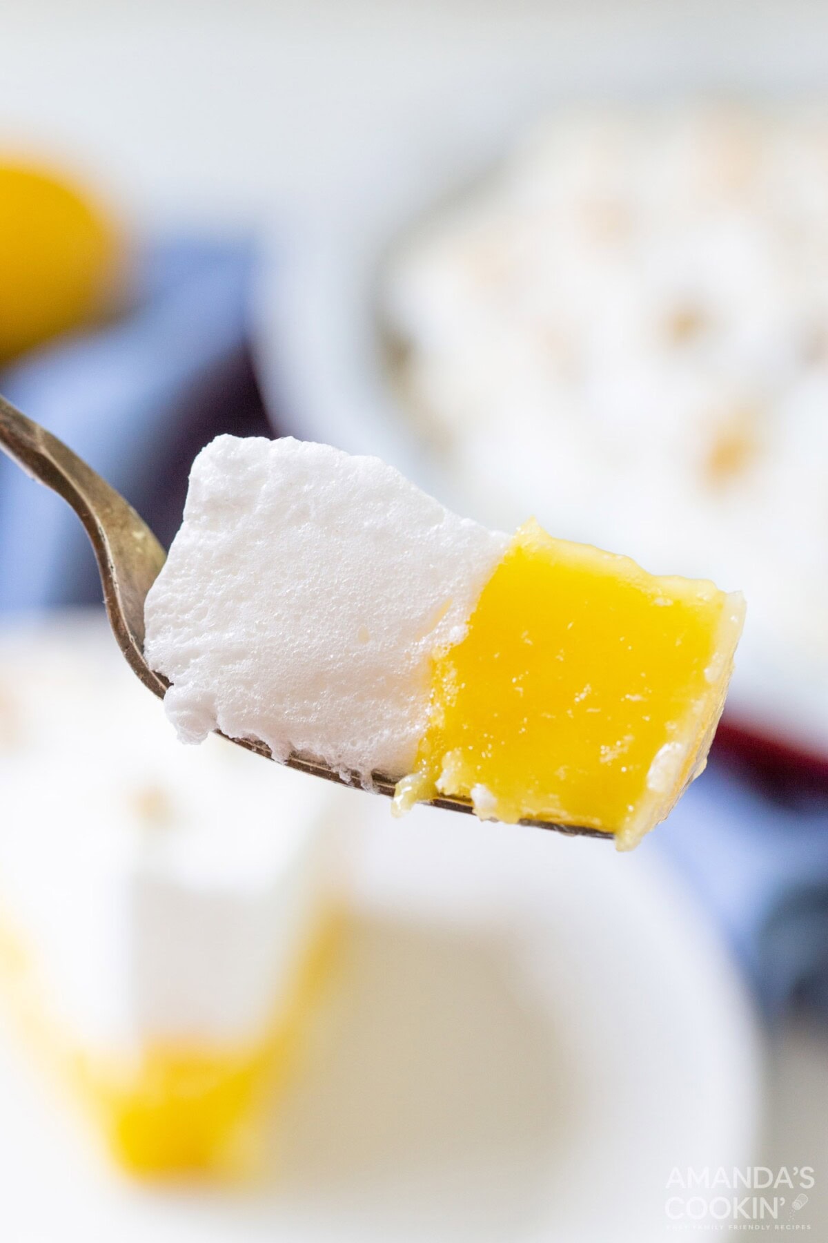 fork full of lemon meringue pie