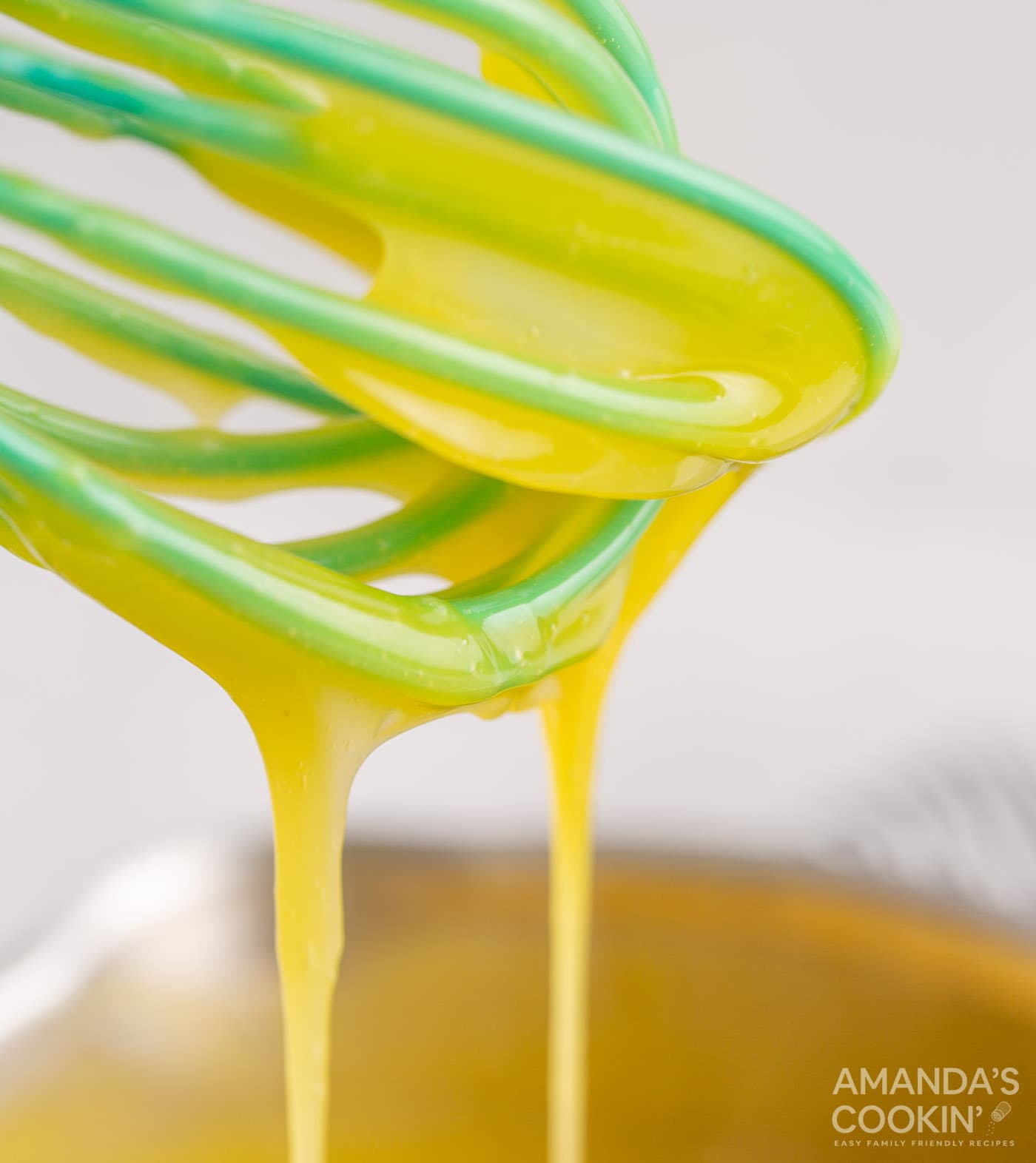 egg mixture drizzle on whisk