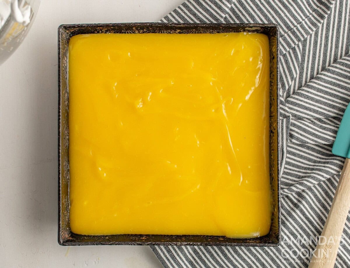 lemon mixture on top of crust in a baking pan