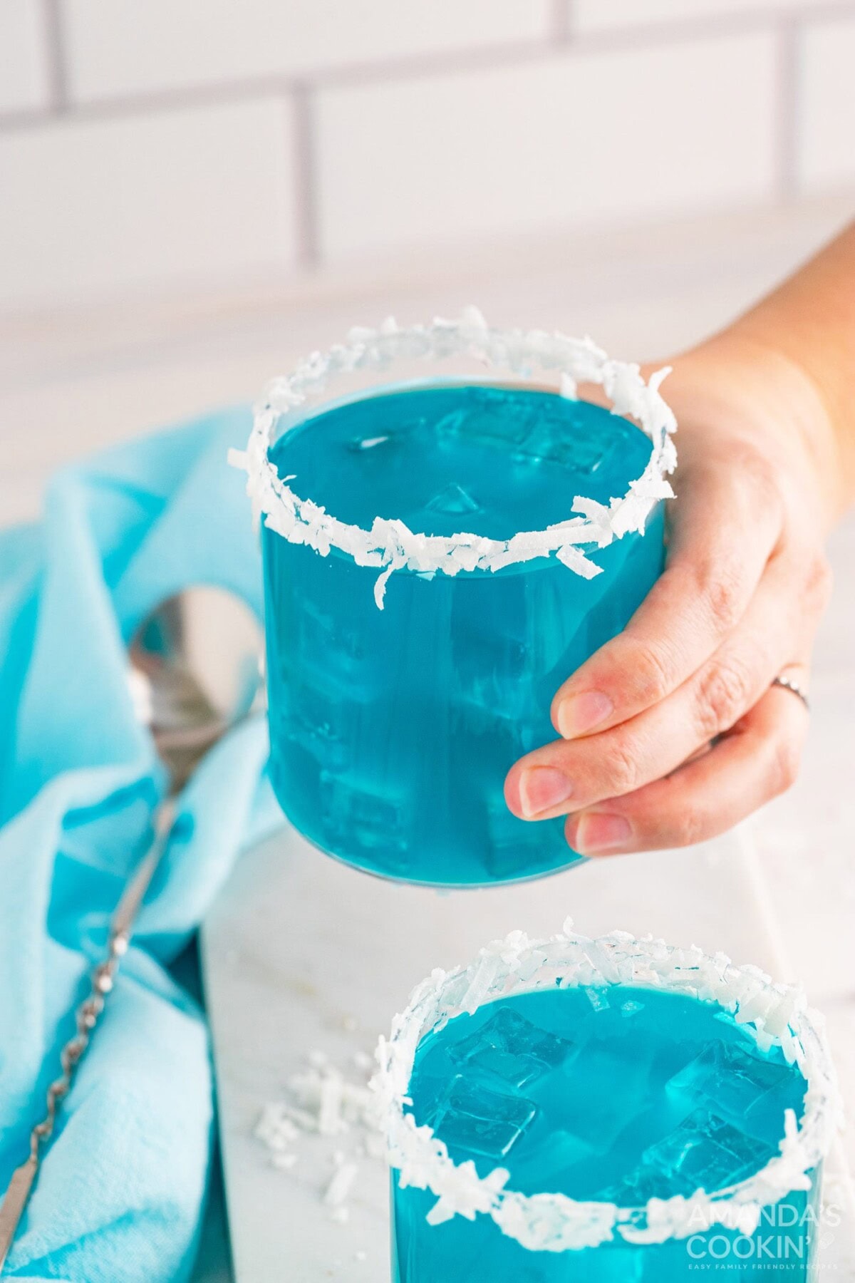 holding an Ocean Water Cocktail