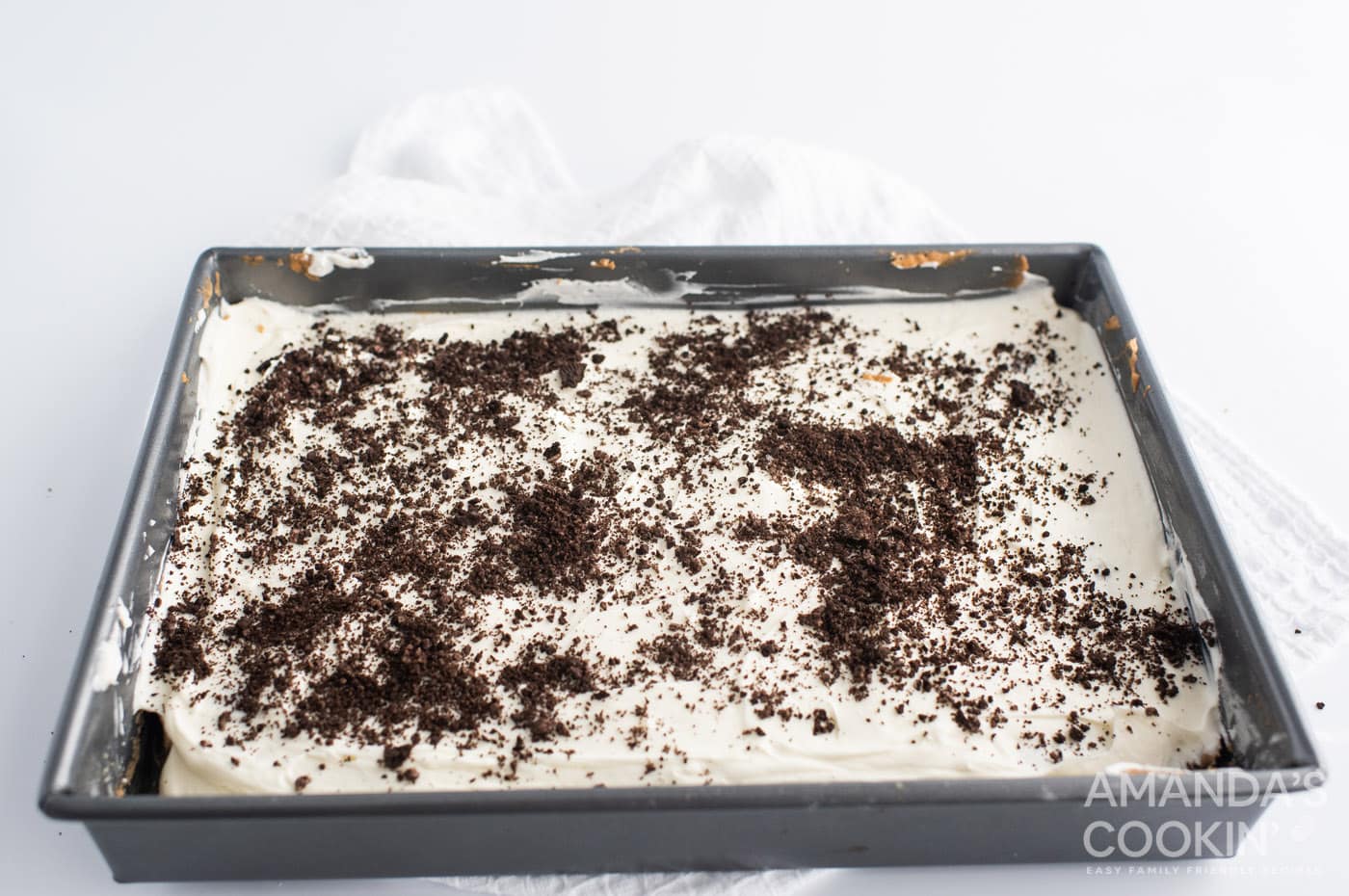 oreo cheesecake bars with oreo crumbles on top
