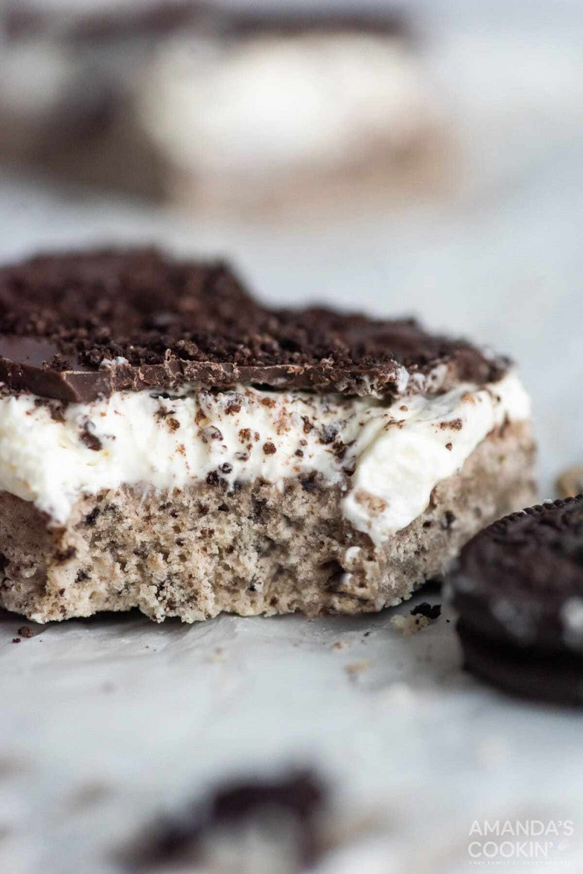 oreo cheesecake bar with a bite out of it