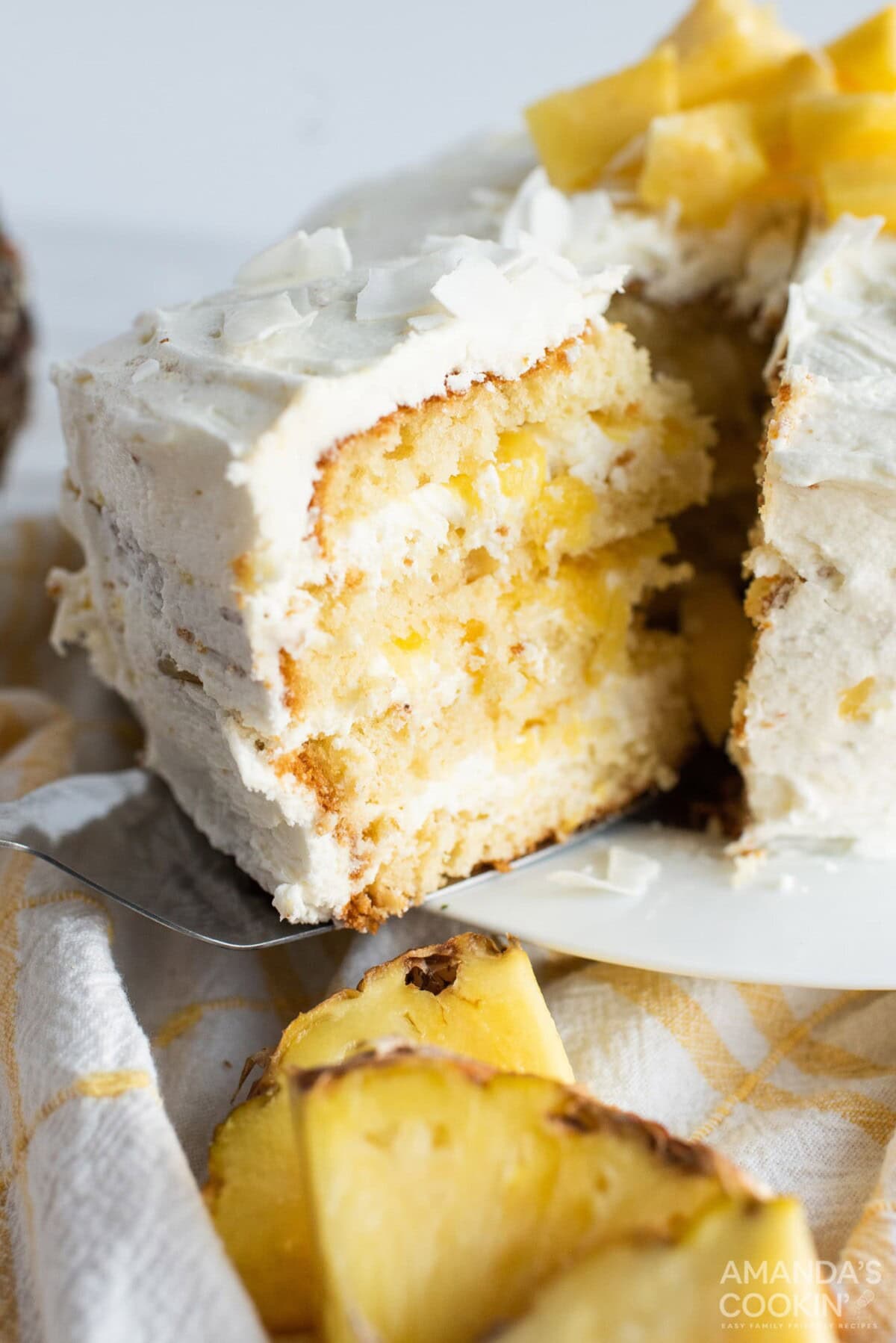 removing a slice of Pineapple Cake