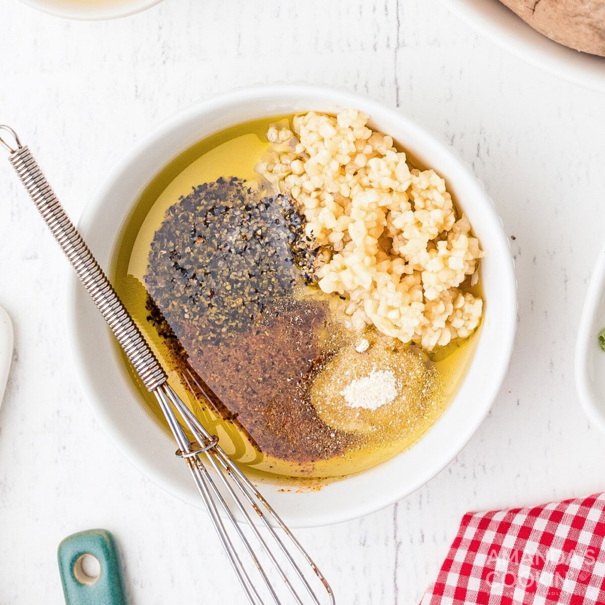 olive oil, minced garlic, creole seasoning, black pepper and onion powder in a mixing bowl