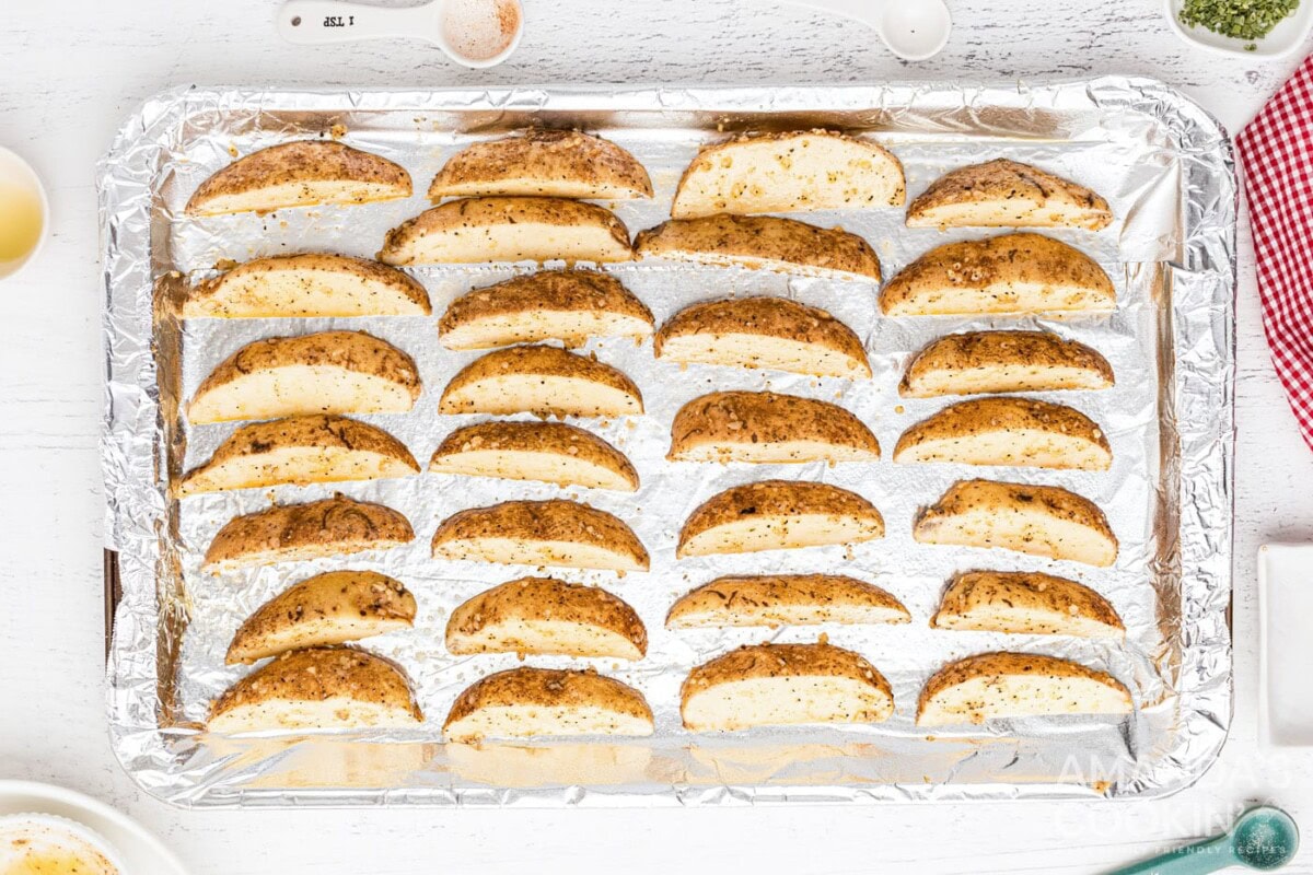 potato wedges on foil lined baking sheet