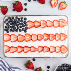 red white and blue poke cake decorated like a USA flag