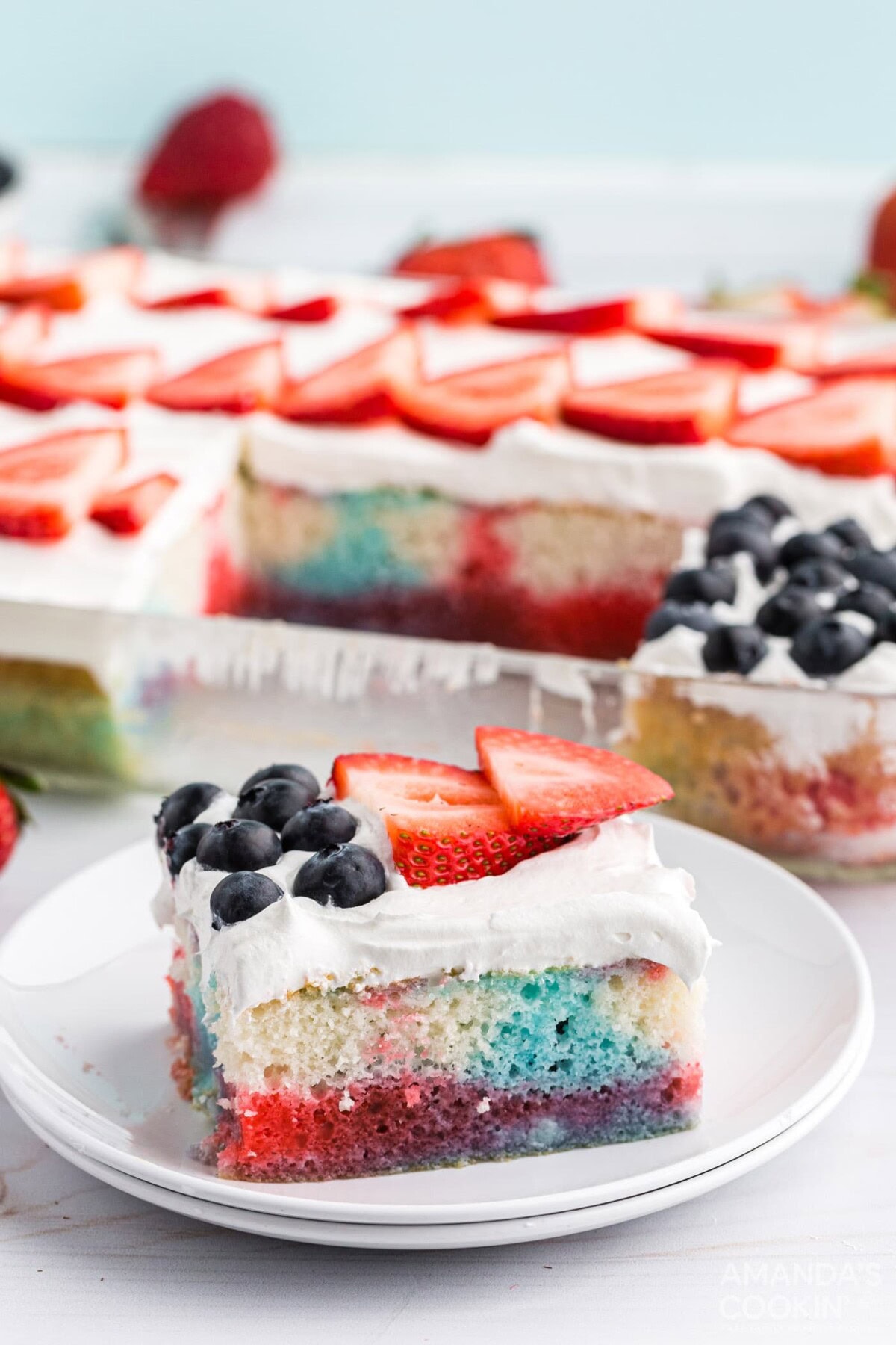slice of red white and blue poke cake