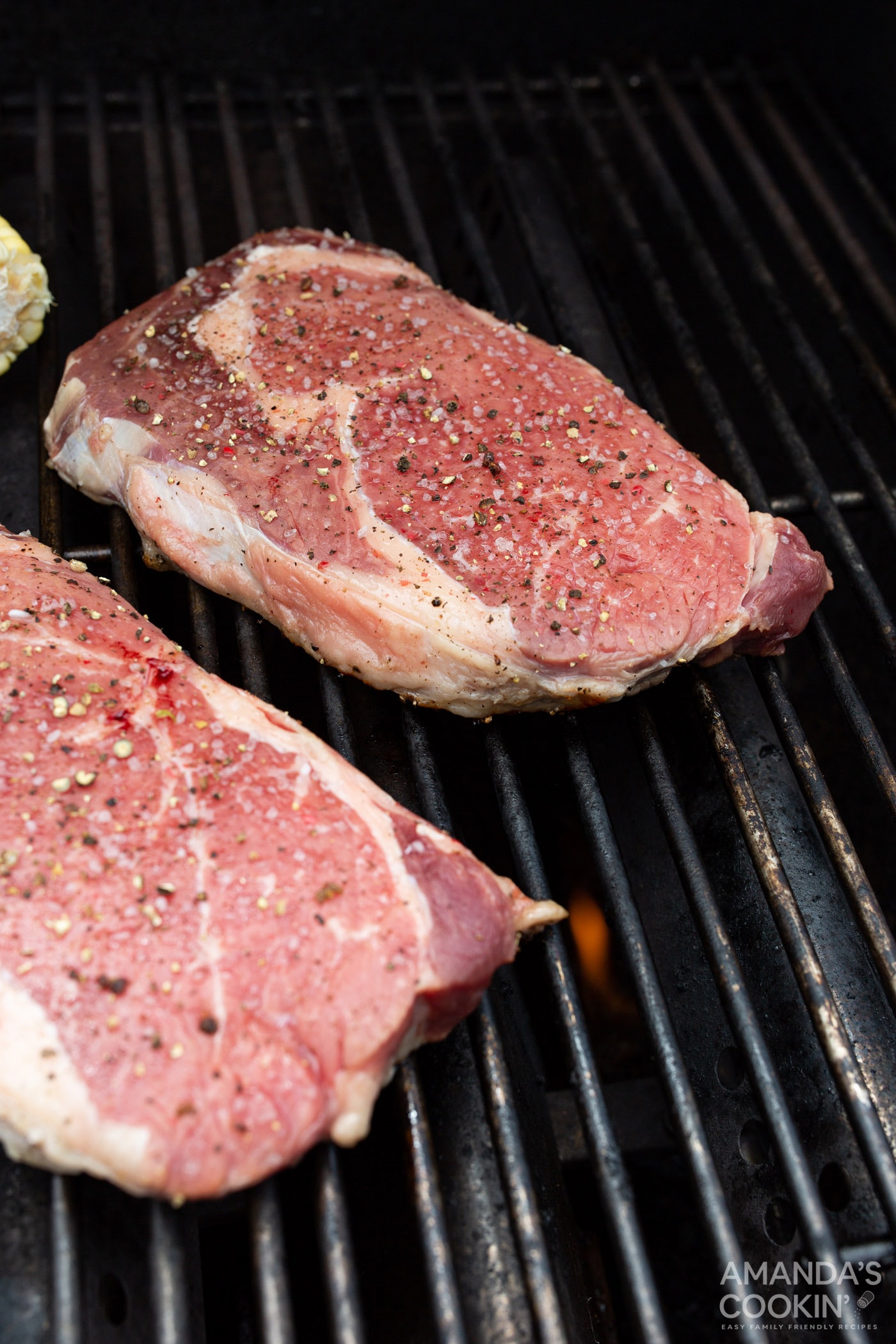new york strip steaks on a grill