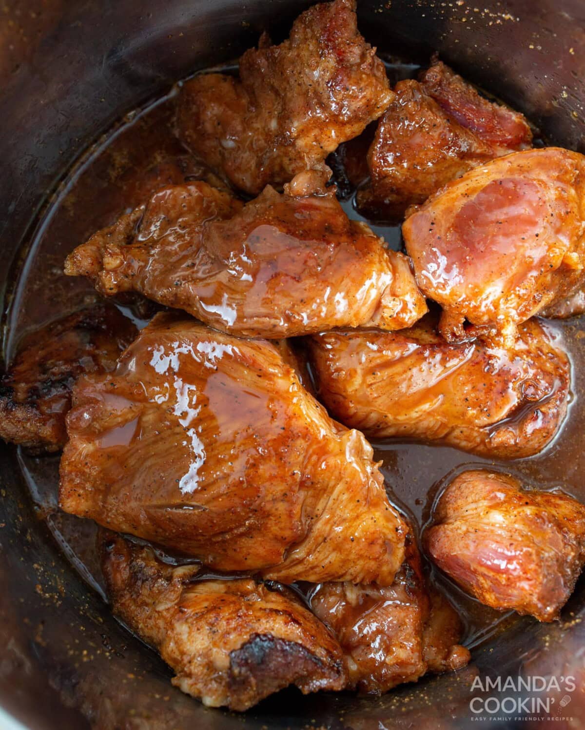 wet ingredients on top of pork shoulder in instant pot