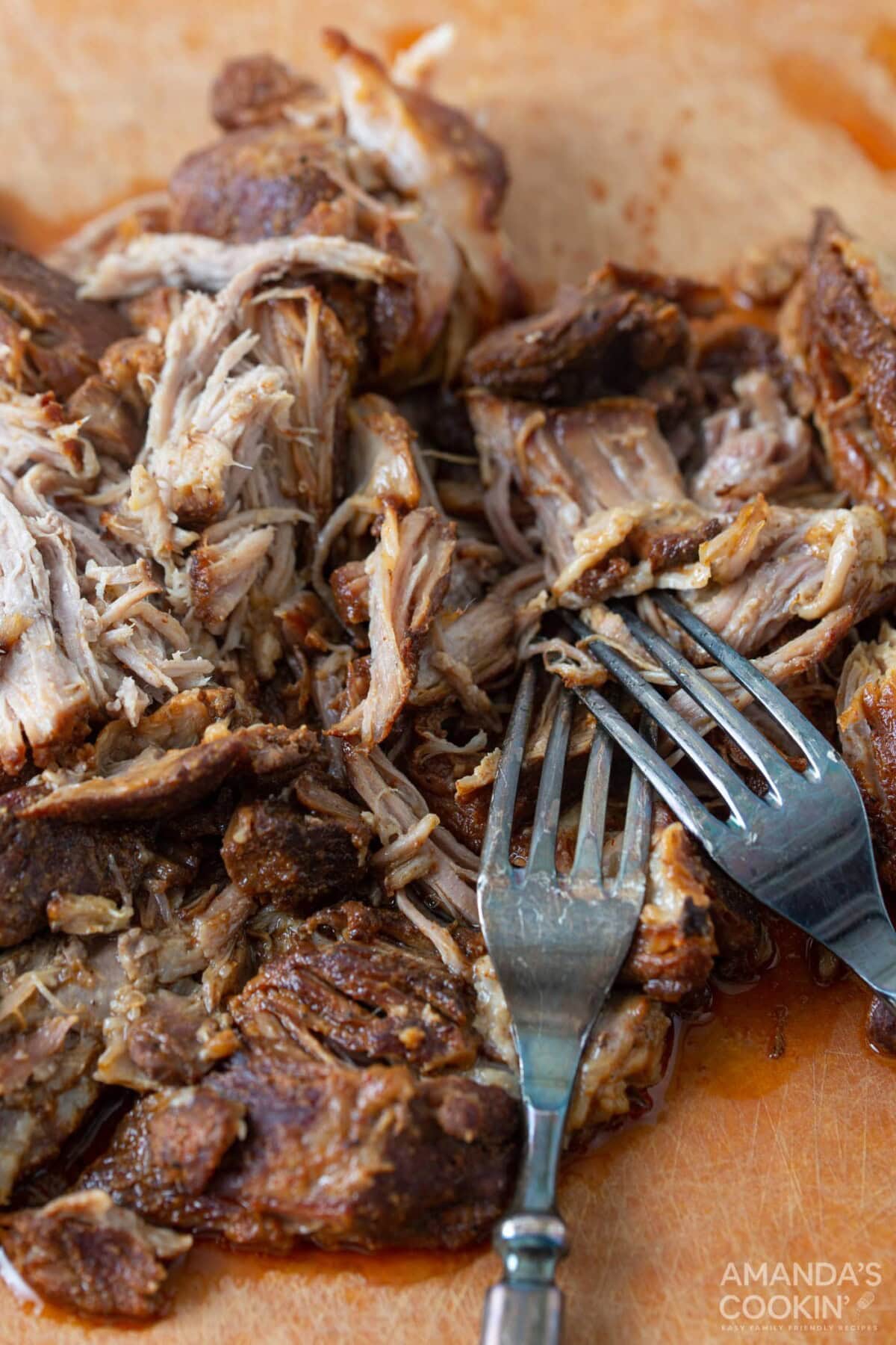 shredding pulled pork with forks