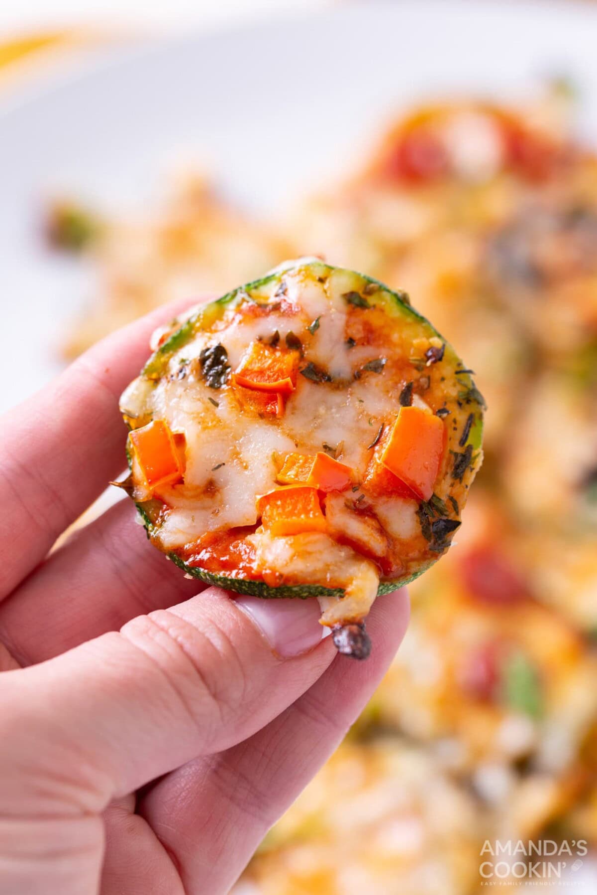 holding a Zucchini Pizza Bite