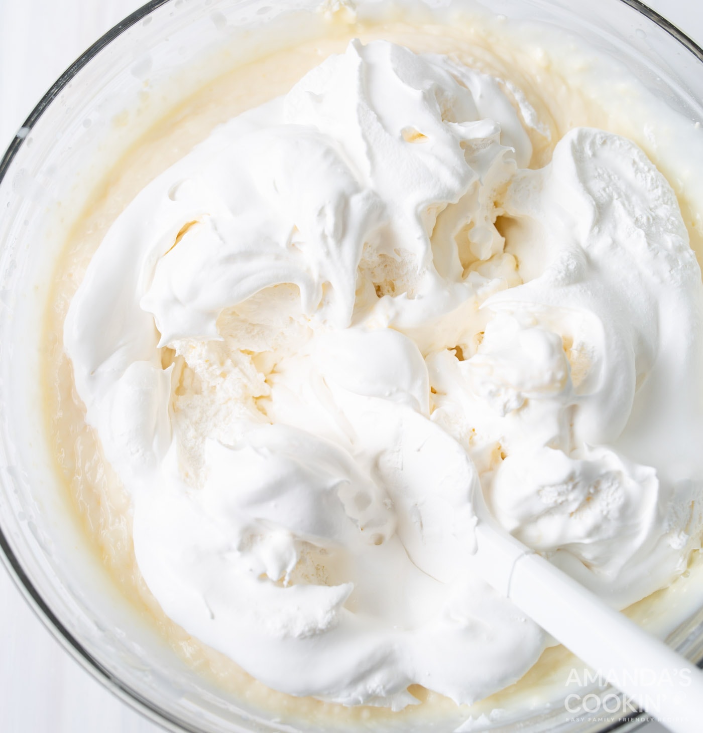 vanilla pudding, cream cheese, and cool whip in a mixing bowl