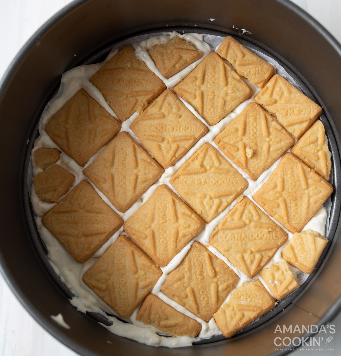 pudding mixture and shortbread cookies layer in springform pan