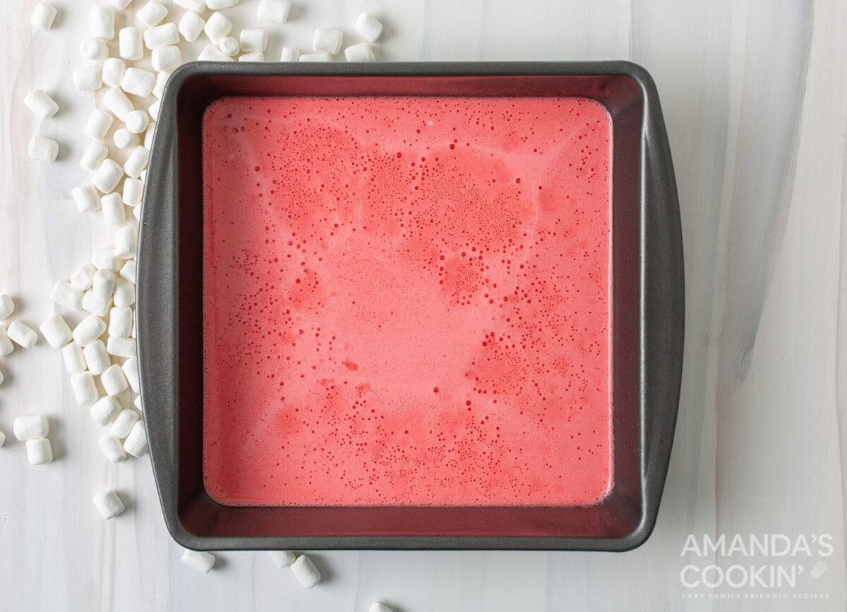 red jello and marshmallow mixture in a pan