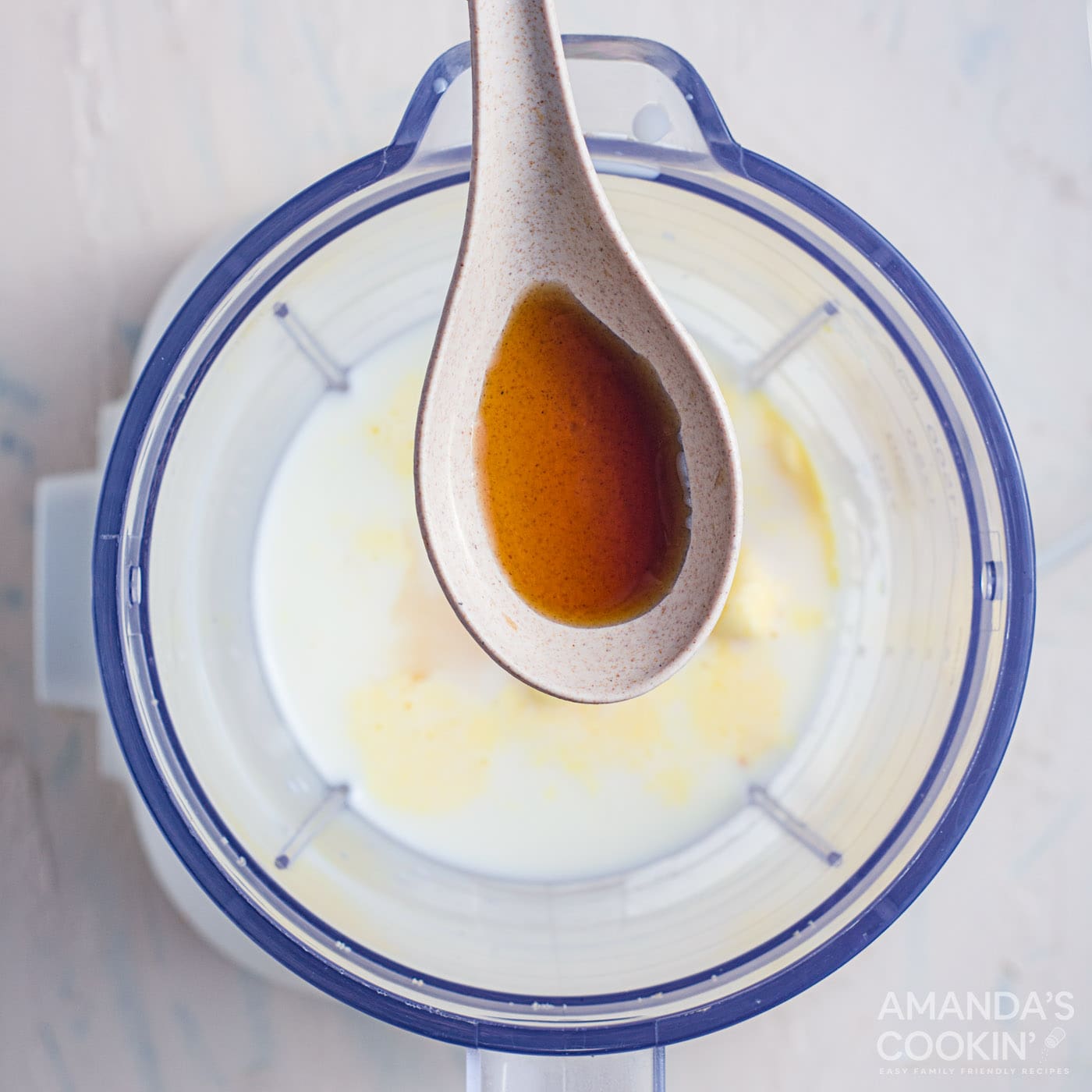 salted caramel sauce in a spoon over blender