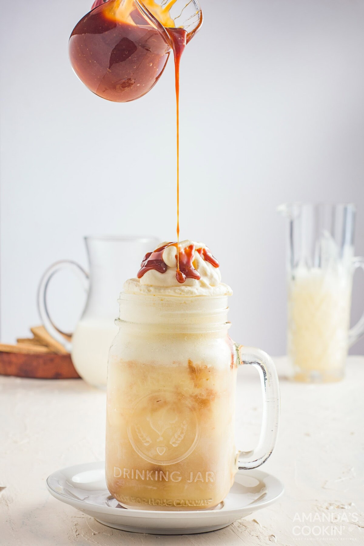 drizzling caramel on top of milkshake