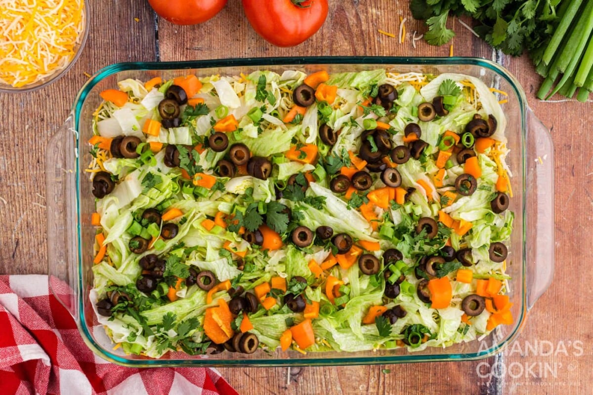 veggies on top of taco dip