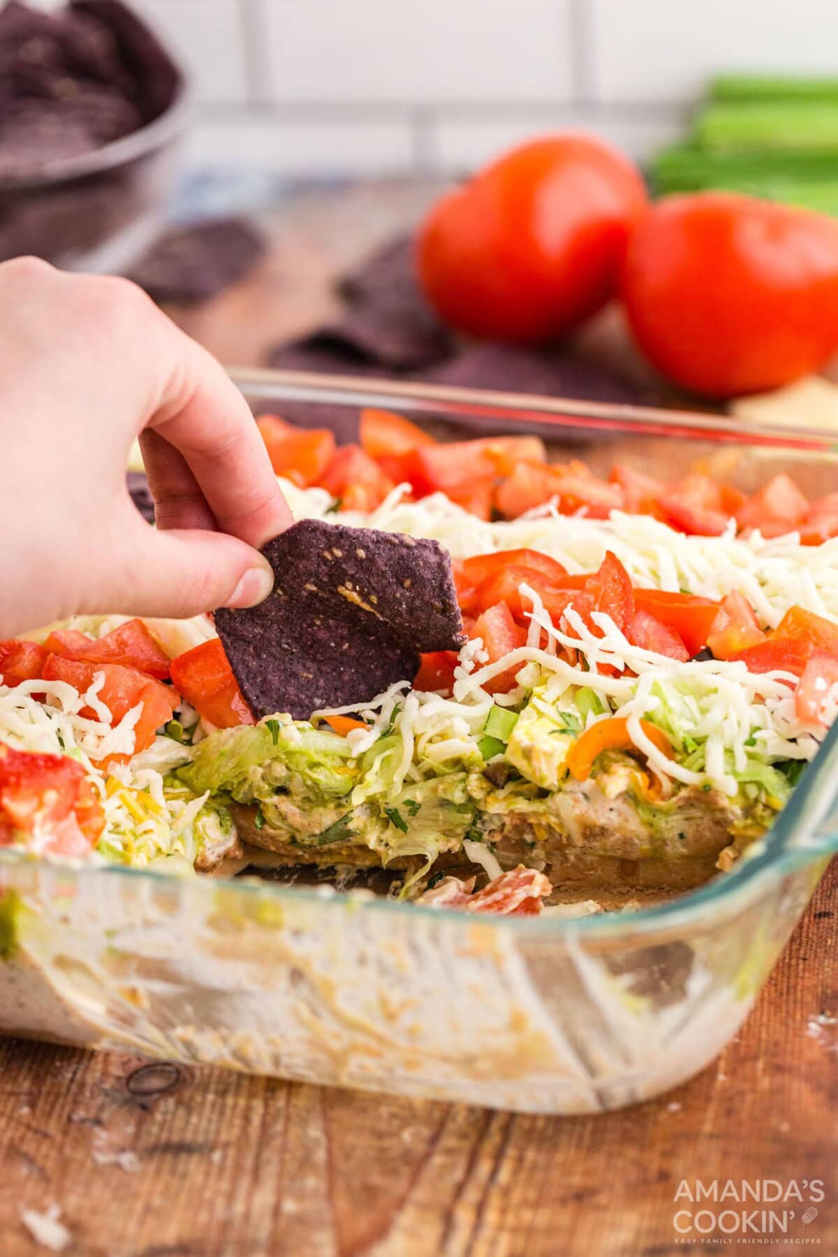 using chip to scoop taco salad
