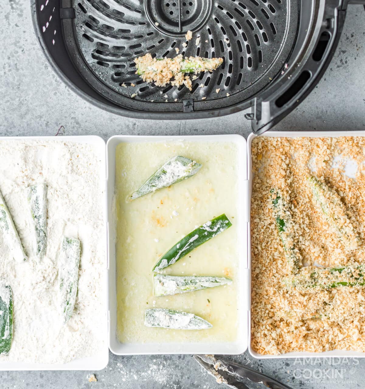 jalapeno slices in dredging stations of buttermilk, panko, and flour