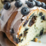 removing slice of Blueberry Bundt Cake
