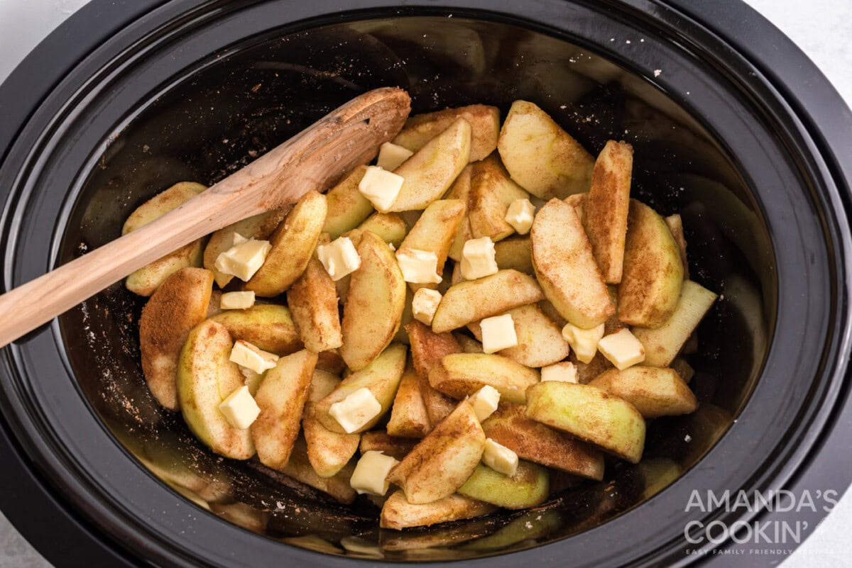 butter on top of cinnamon sugar apples