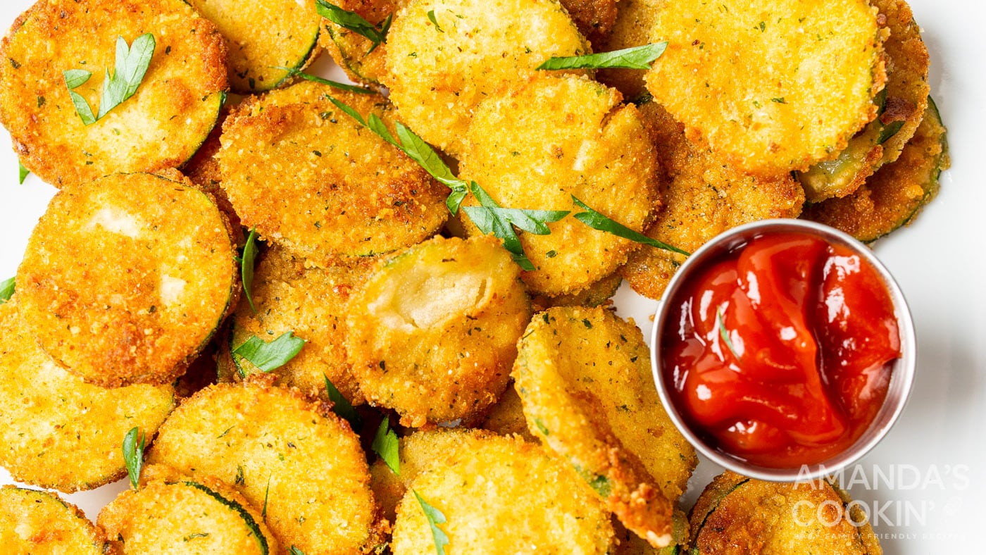 These parmesan fried zucchini rounds coated in Italian-style breadcrumbs are tender, crunchy, and a 
