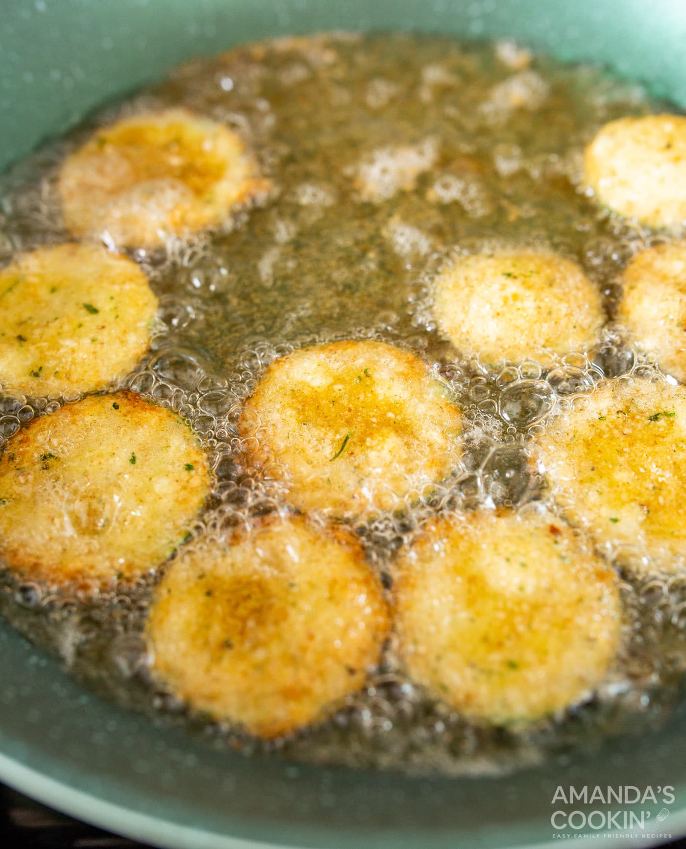 fried zucchini with oil in a skillet