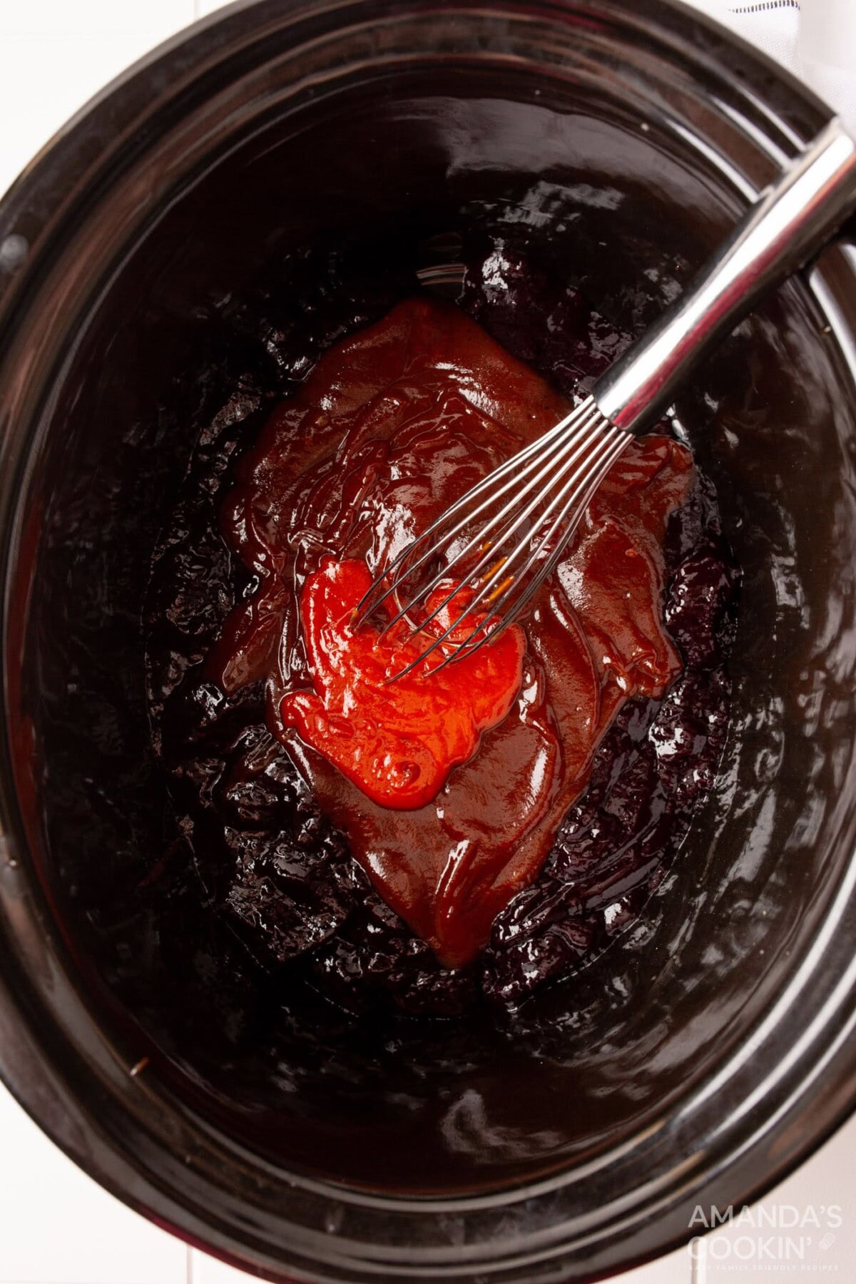 sweet and spicy meatball sauce in crockot