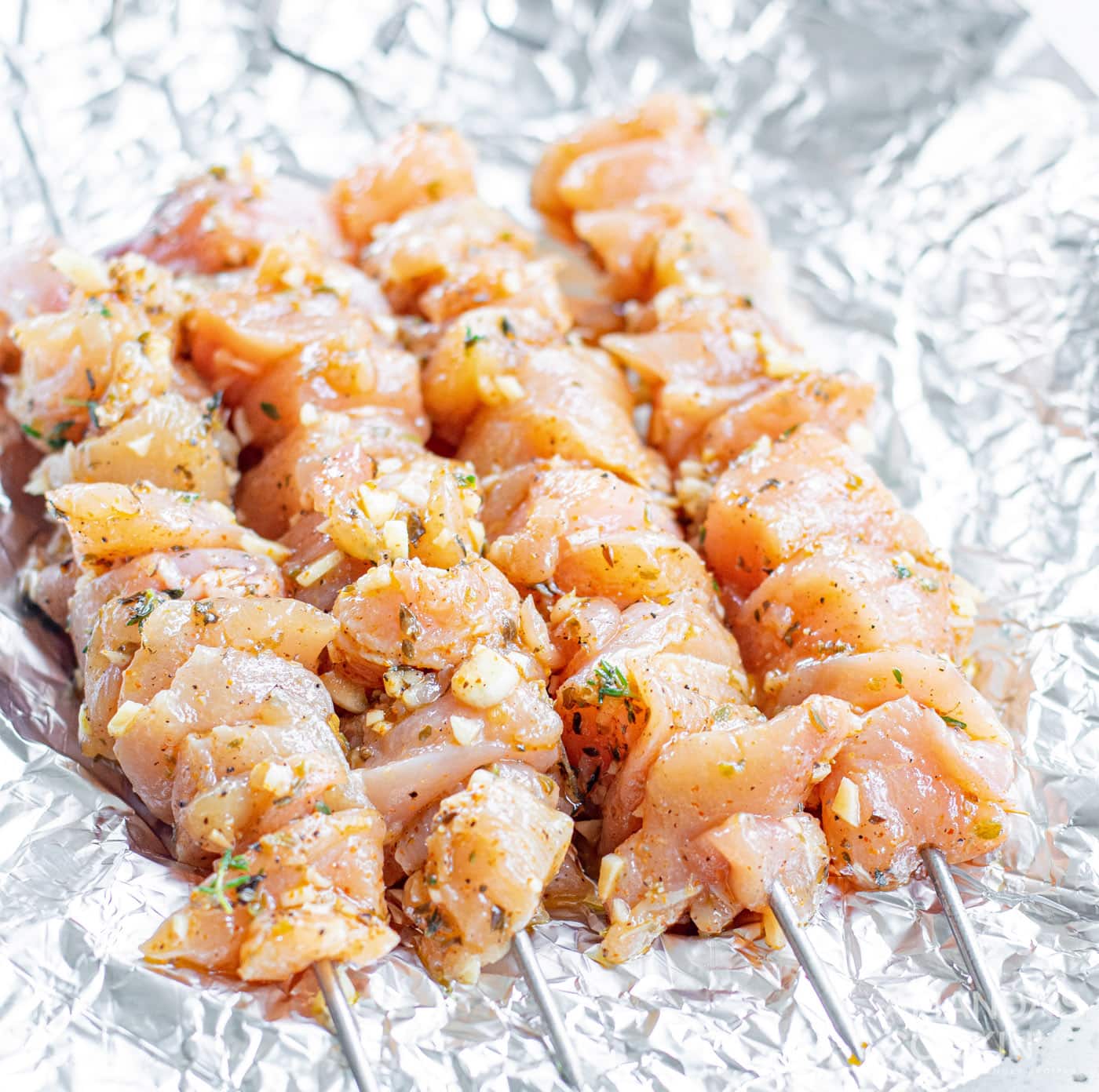chicken skewers on tin foil