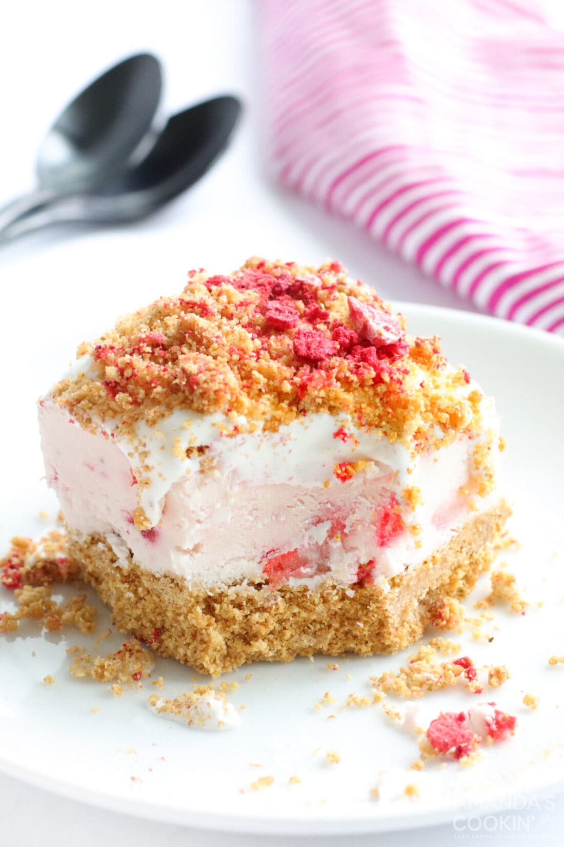 No Bake Strawberry Cheesecake Bars with a bite out of it