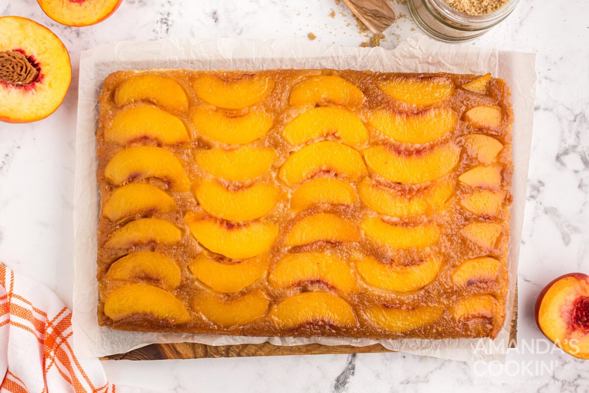 baked peach upside down cake in a glass dish