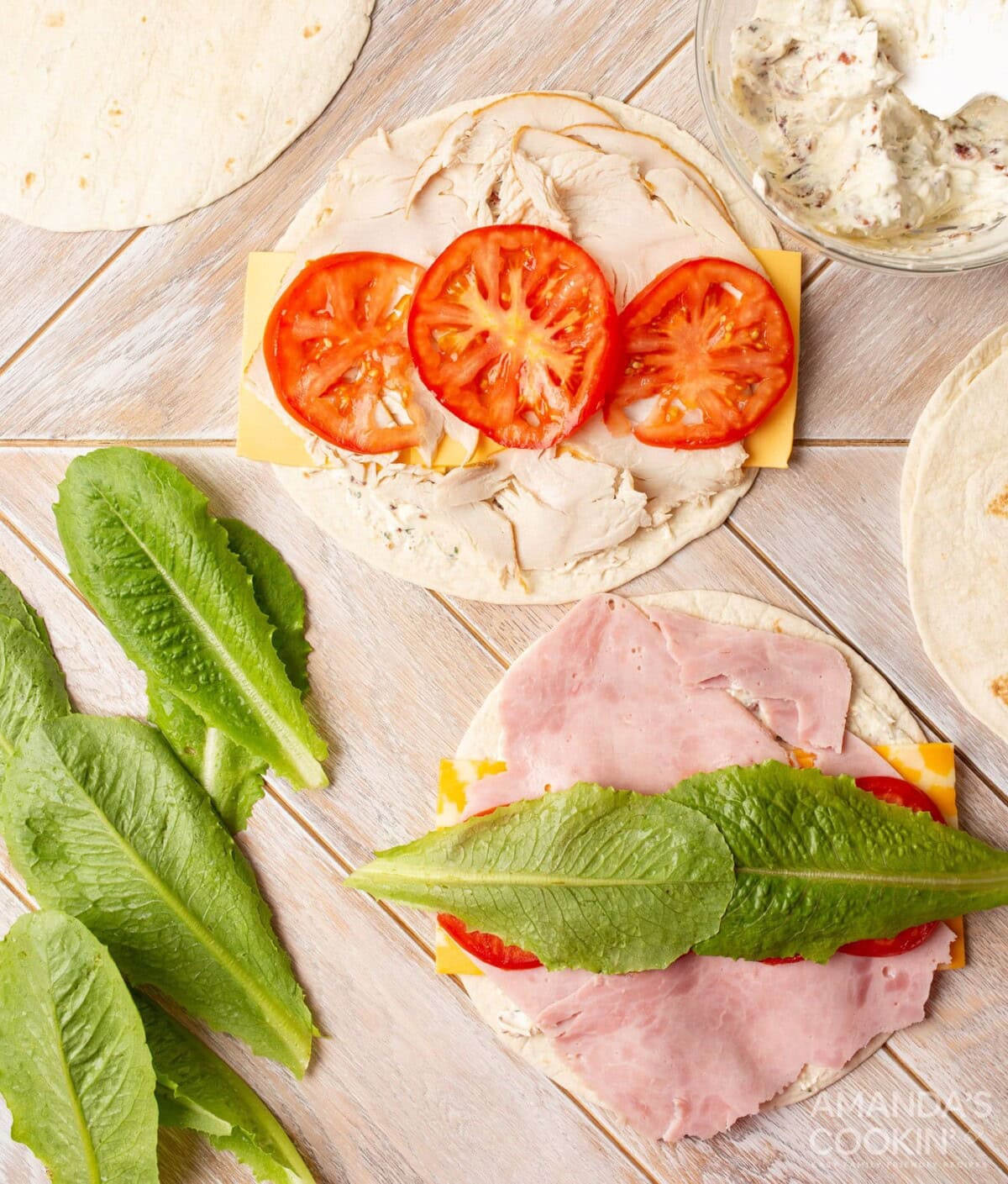 tomato and lettuce leaf on pinwheel sandwich tortillas