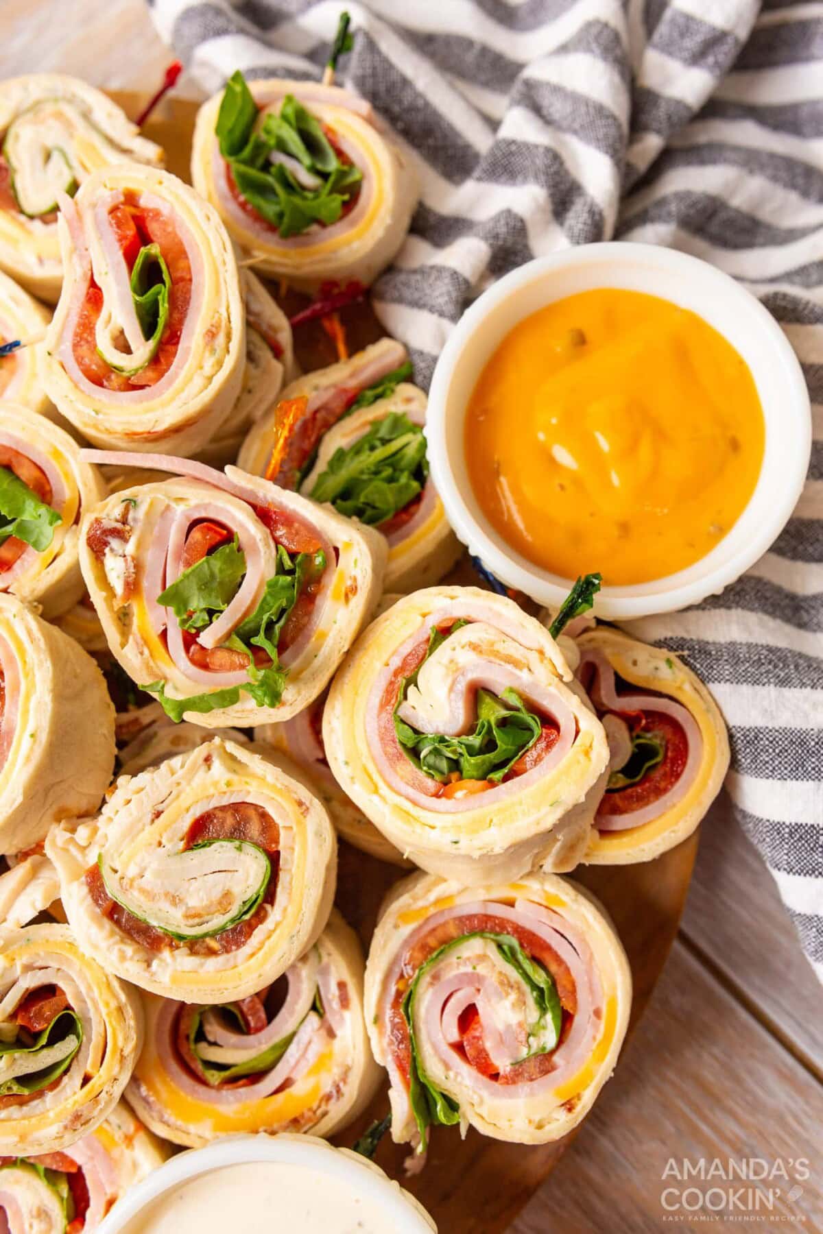 club-style Pinwheel Sandwiches with a dip