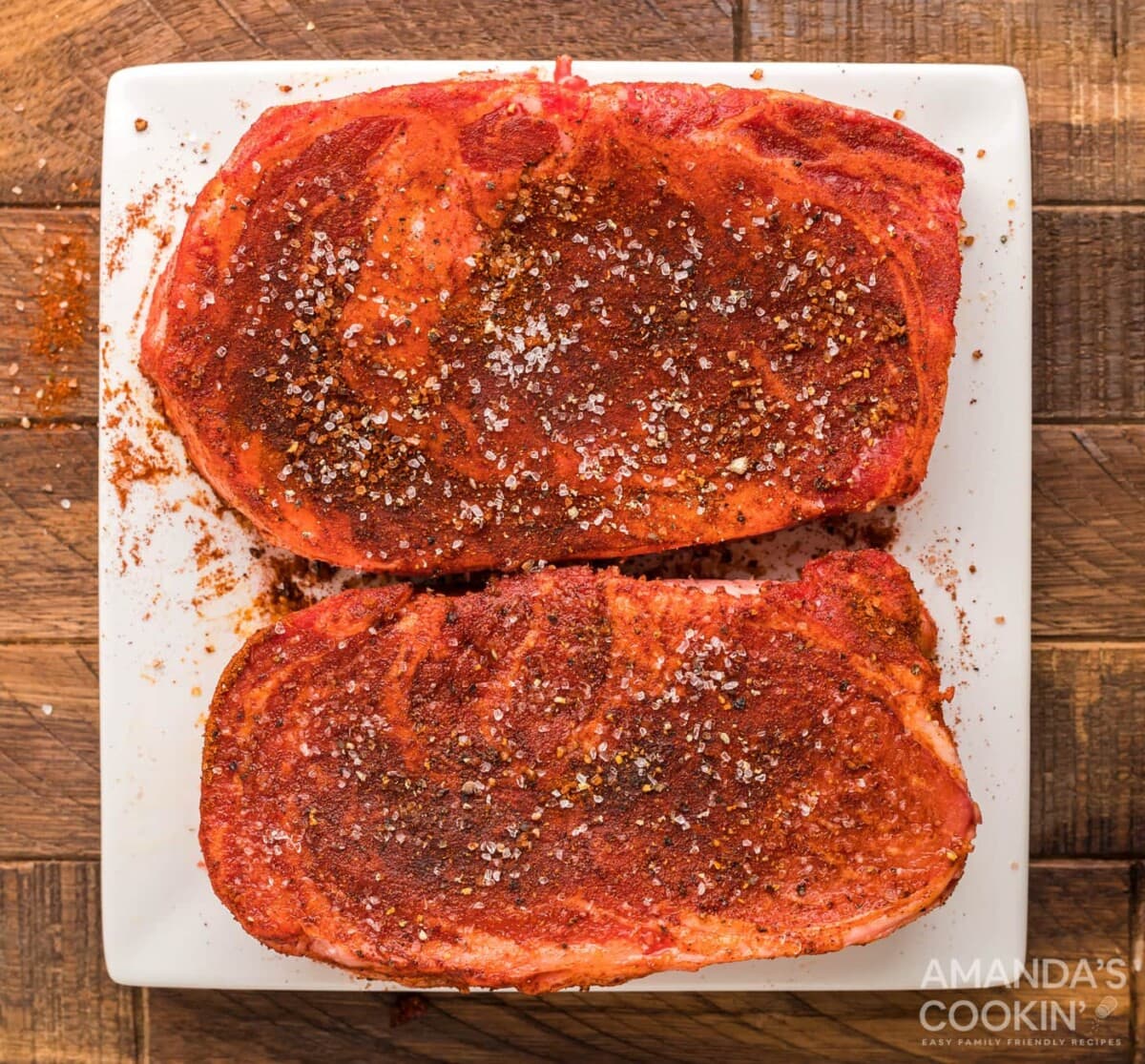 seasoned ribeye on cutting board