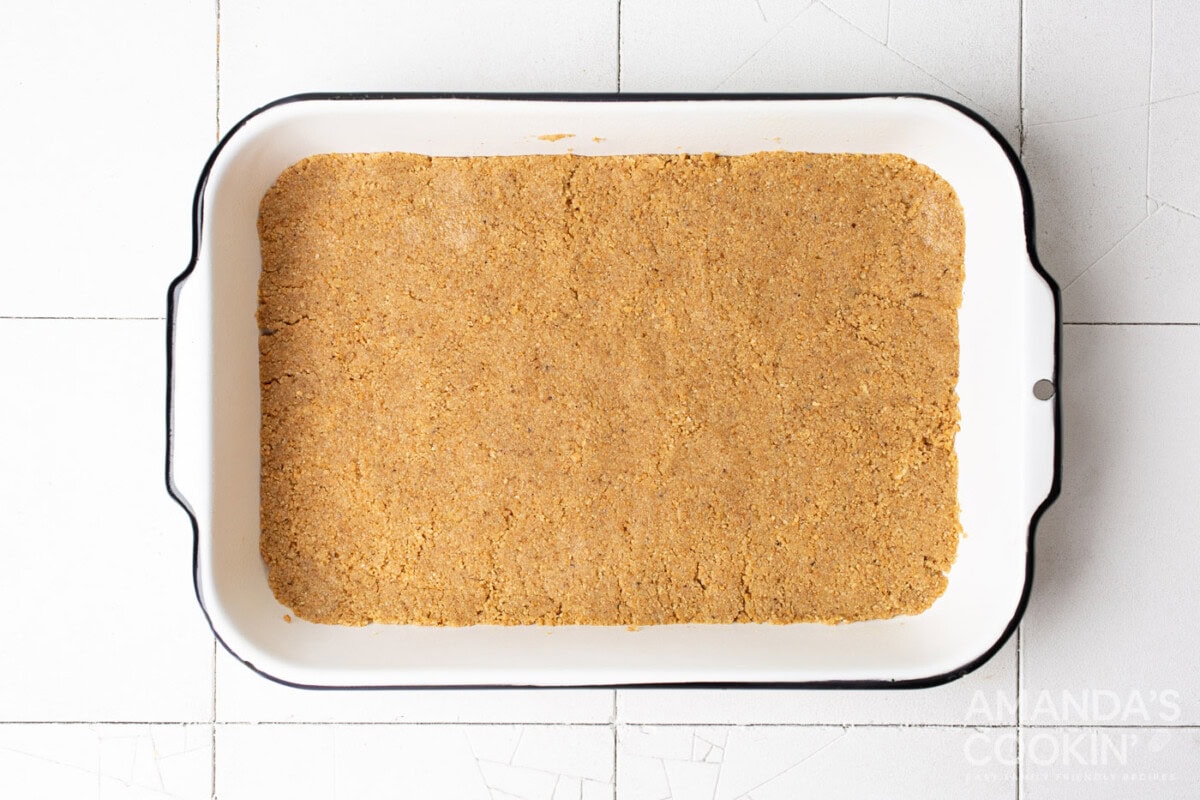graham cracker crust in a baking pan